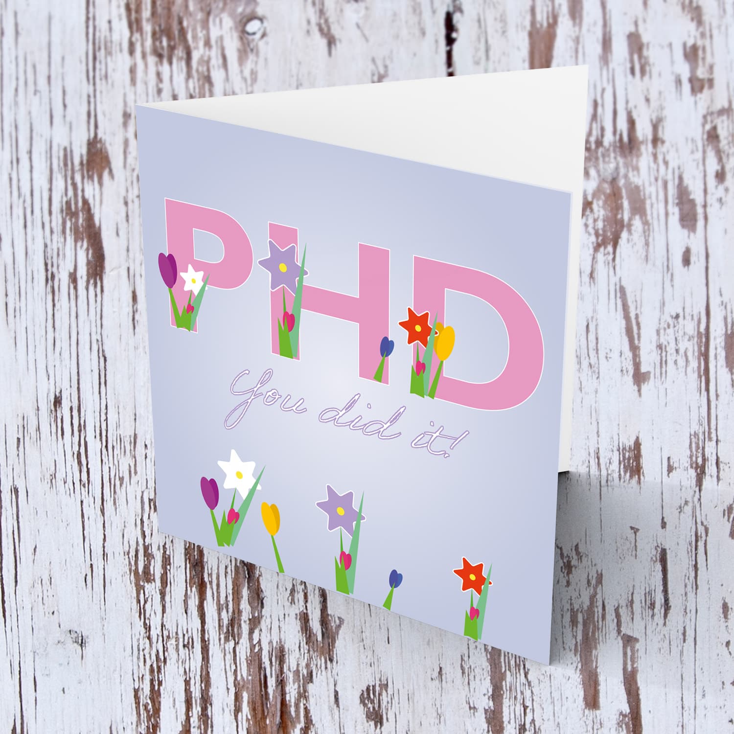 PHD - Graduation card in English (flowers coming out of text and lilac background)  