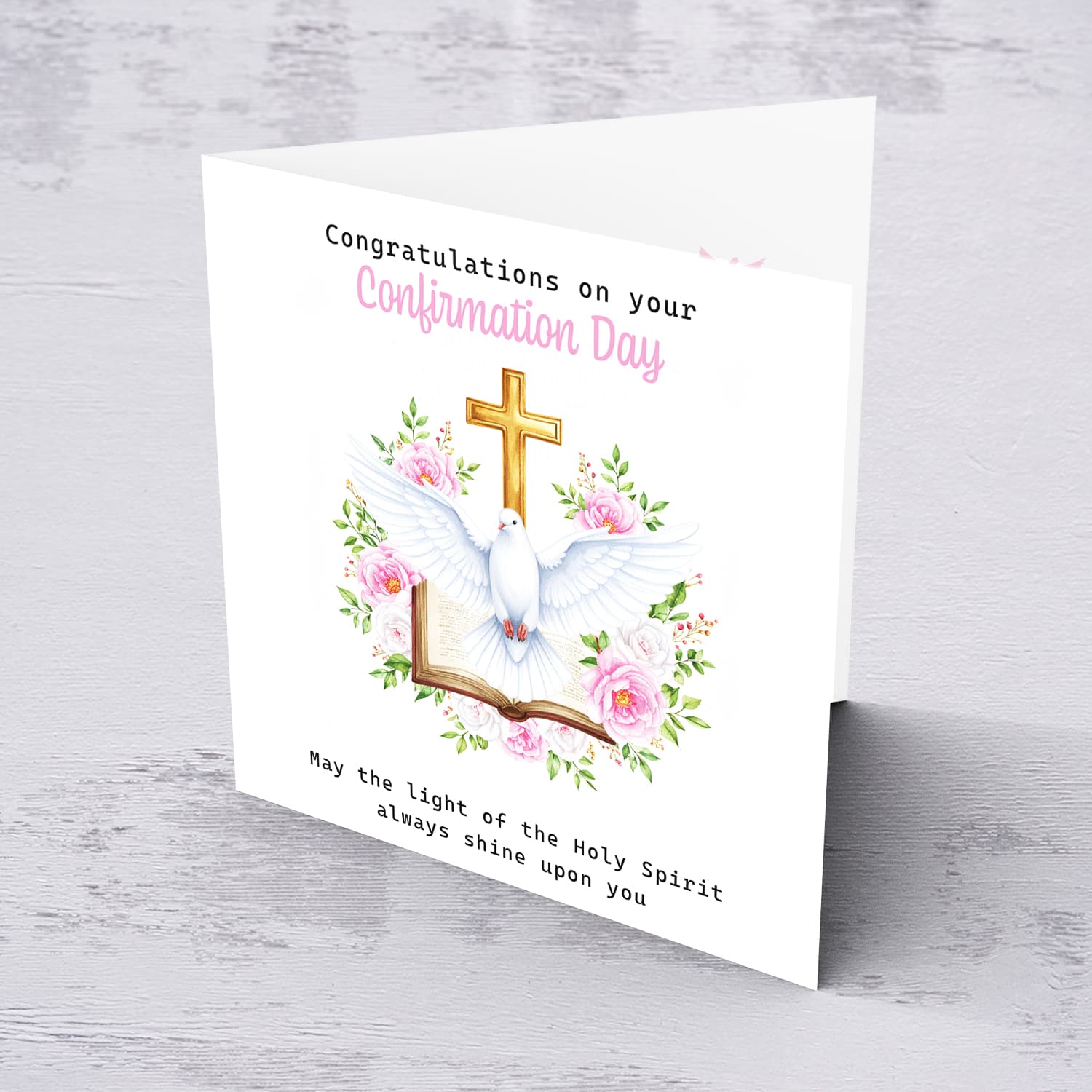 An open Confirmation card for Girls featuring the Holy Spirit dove, an open Bible and beautiful pink and white flowers in English