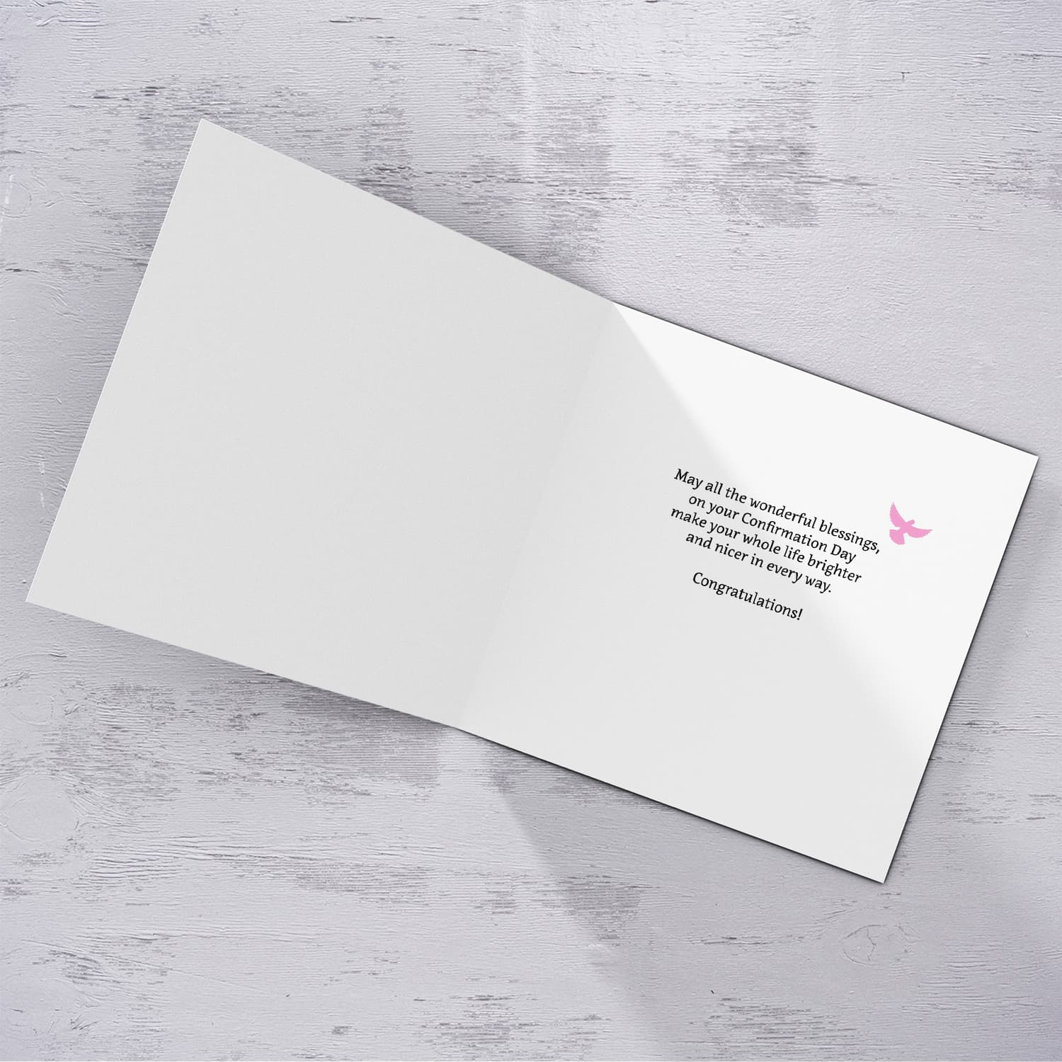 An open Confirmation card for Girls featuring the Holy Spirit dove, an open Bible and beautiful pink and white flowers in English