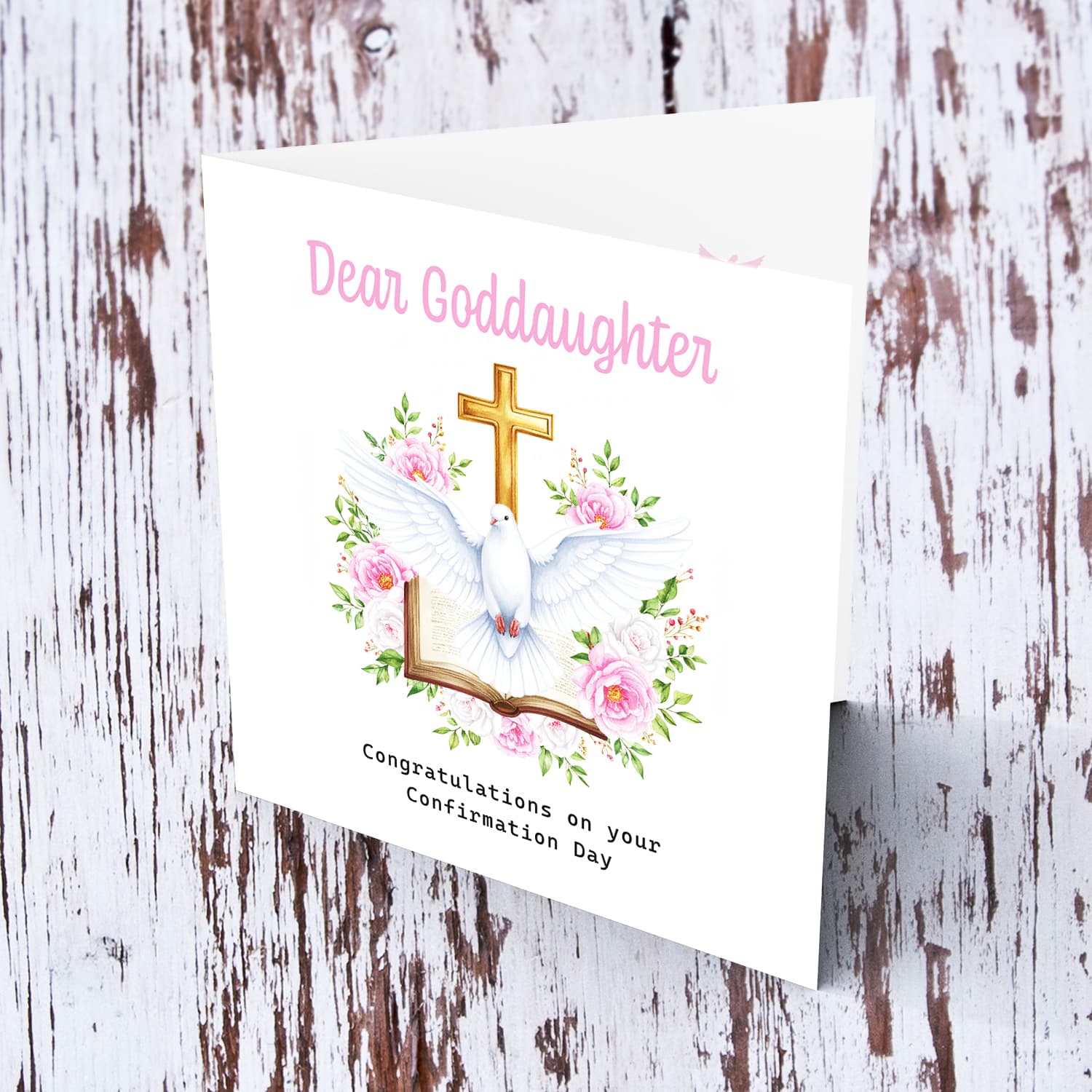 An elegant Confirmation card for Goddaughter featuring the Holy Spirit dove, an open Bible and beautiful pink and white flowers in English
