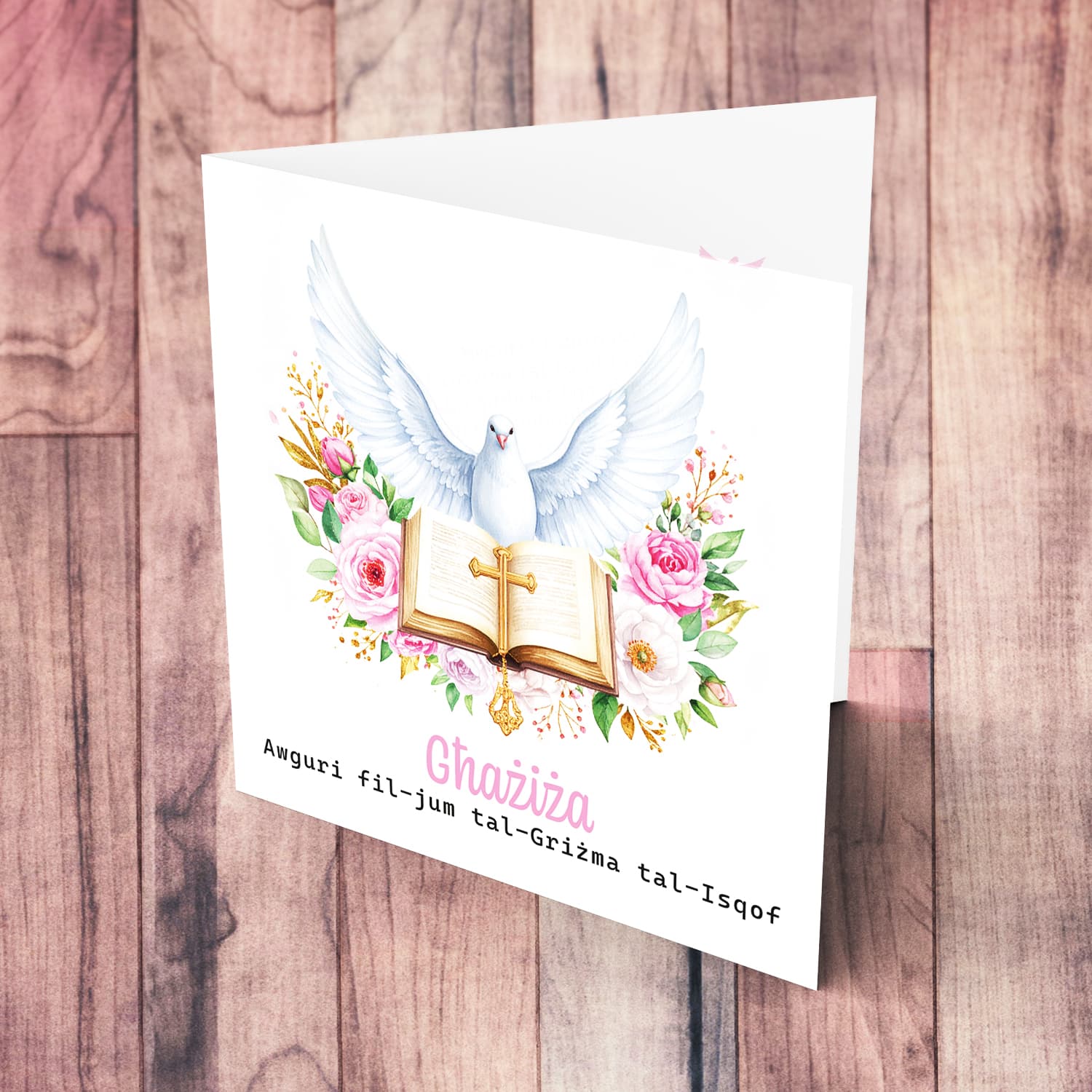 An open Confirmation card for Girls featuring the Holy Spirit dove, an open Bible and beautiful pink and white flowers in Maltese
