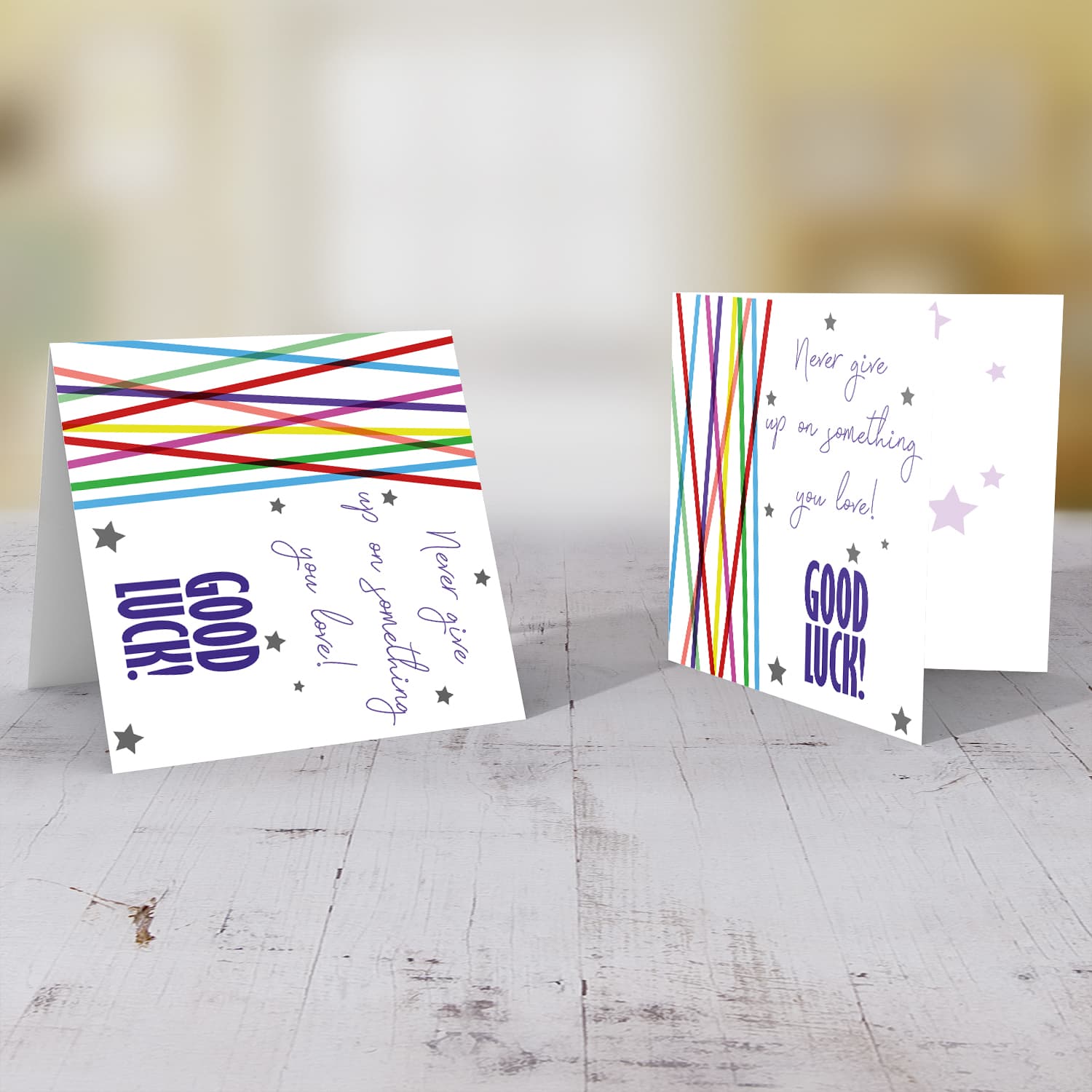 Colourful lines and scattered hearts - never give up good luck card in English