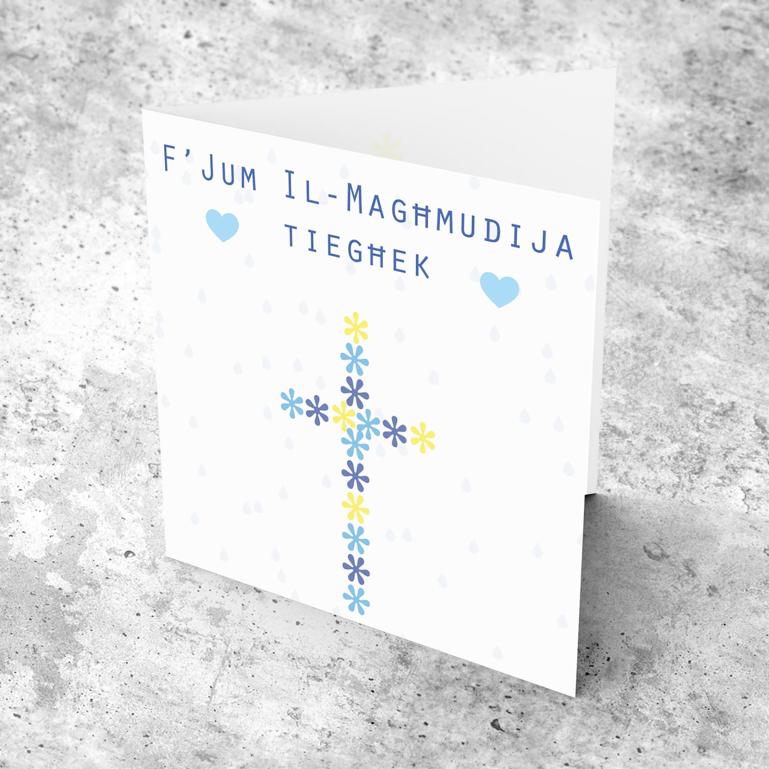 Floral cross in shades of blue and yellow baptism card in Maltese
