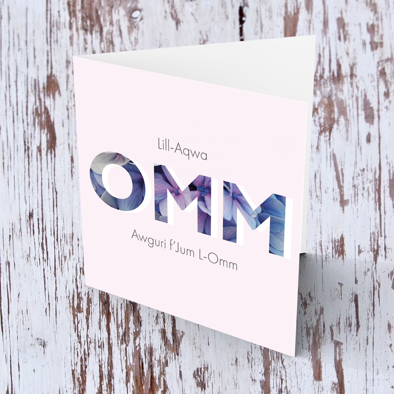 Pastel pink background with floral wording  Mother's Day Card in  Maltese