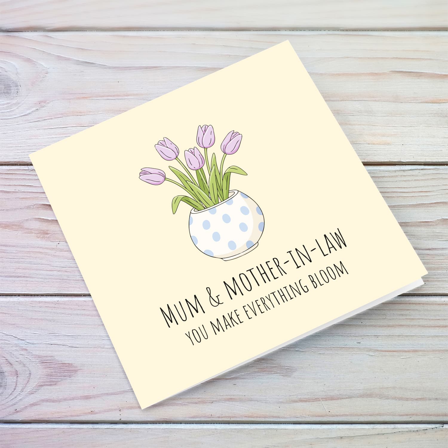 A beautiful mother's day card for mother and mother-in-law featuring light purple tulips in spotted vase and neutral background in English
