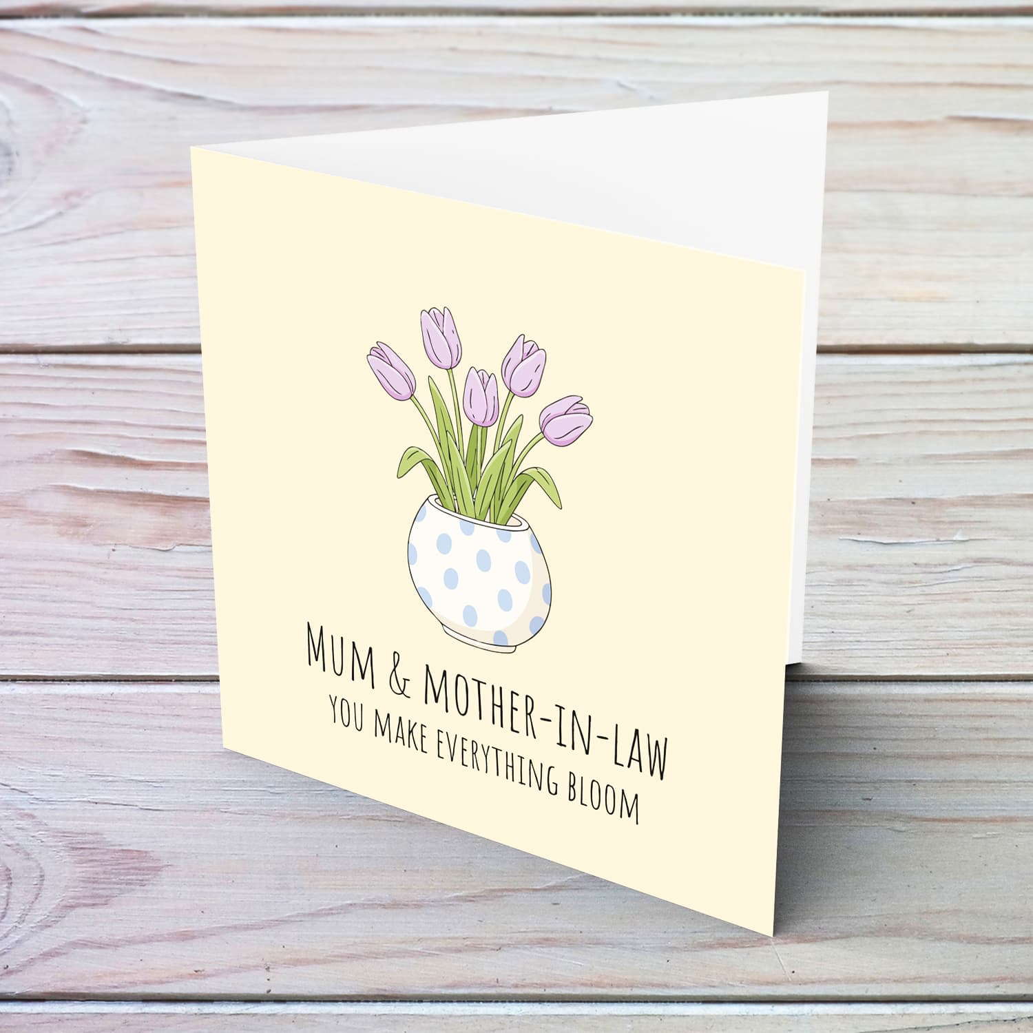 A beautiful mother's day card for mother and mother-in-law featuring light purple tulips in spotted vase and neutral background in English