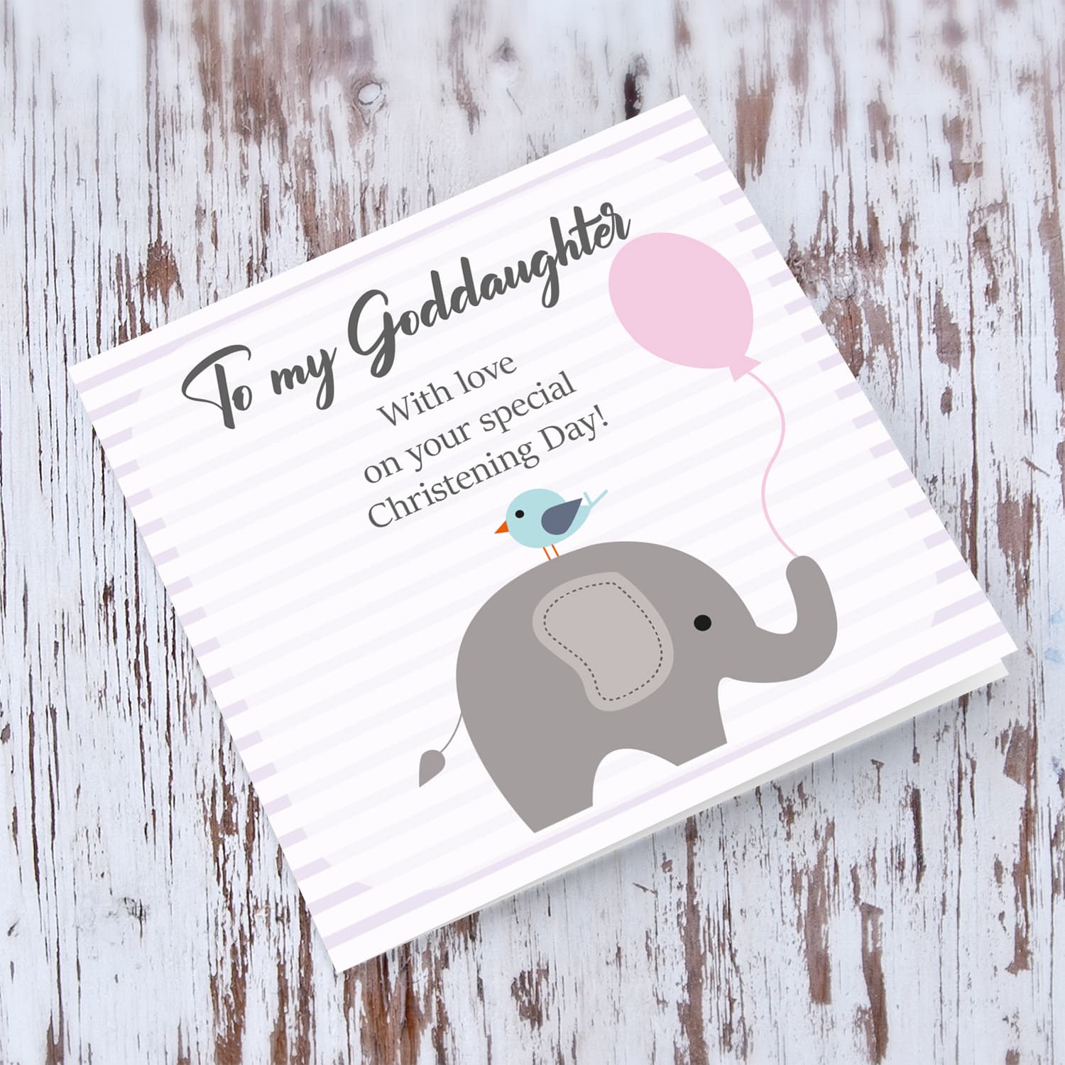 Elephant with bird holding pink balloon, with striped background baptism card for Goddaughter in English