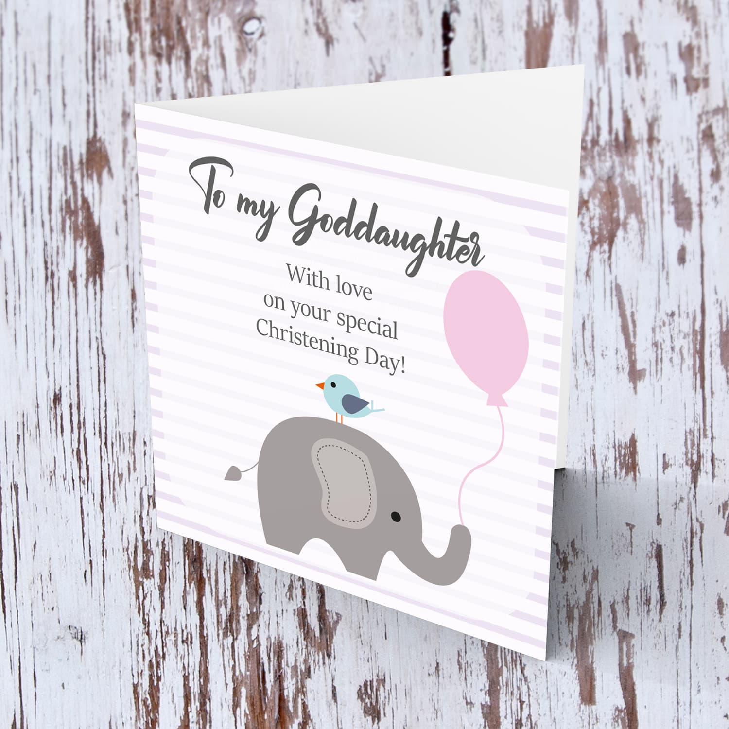 Elephant with bird holding pink balloon, with striped background baptism card for Goddaughter in English