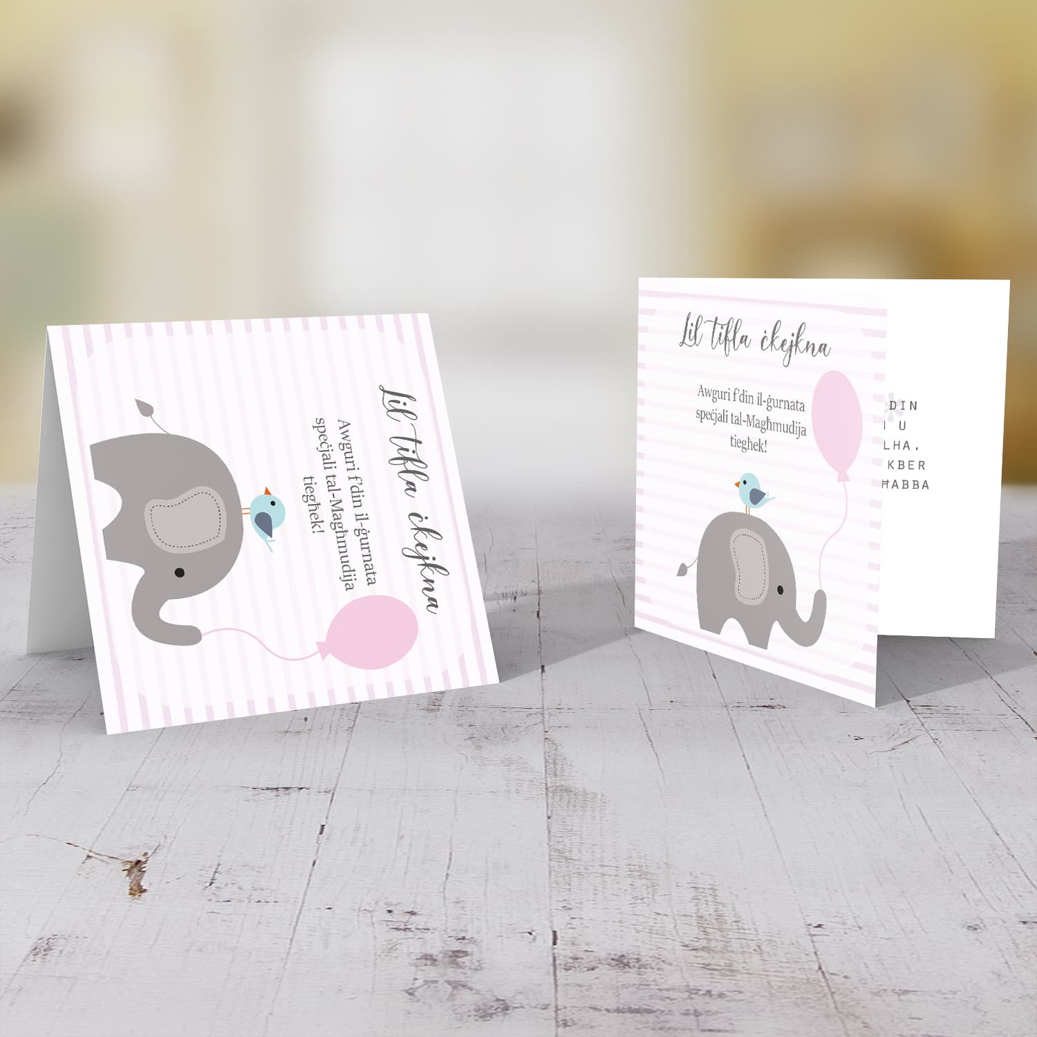 Pink striped background with elephant holding pink balloon baptism card for a little girl in Maltese