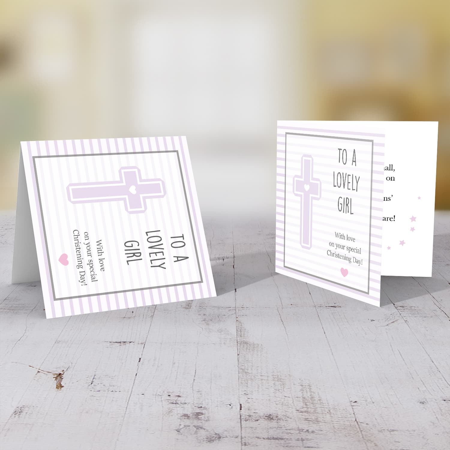Pink striped background with a cross baptism card for a lovely girl in English