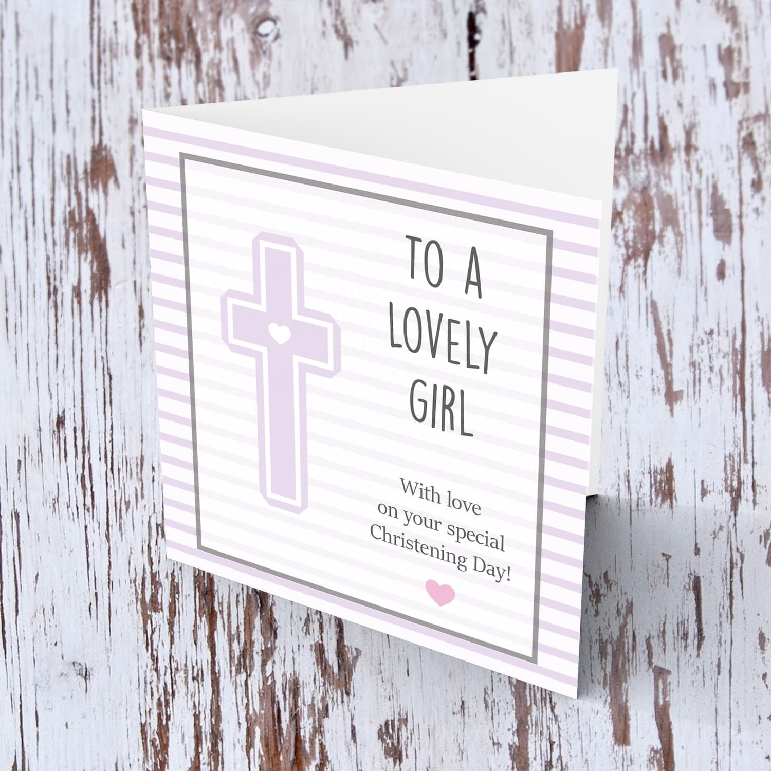 Pink striped background with a cross baptism card for a lovely girl in English