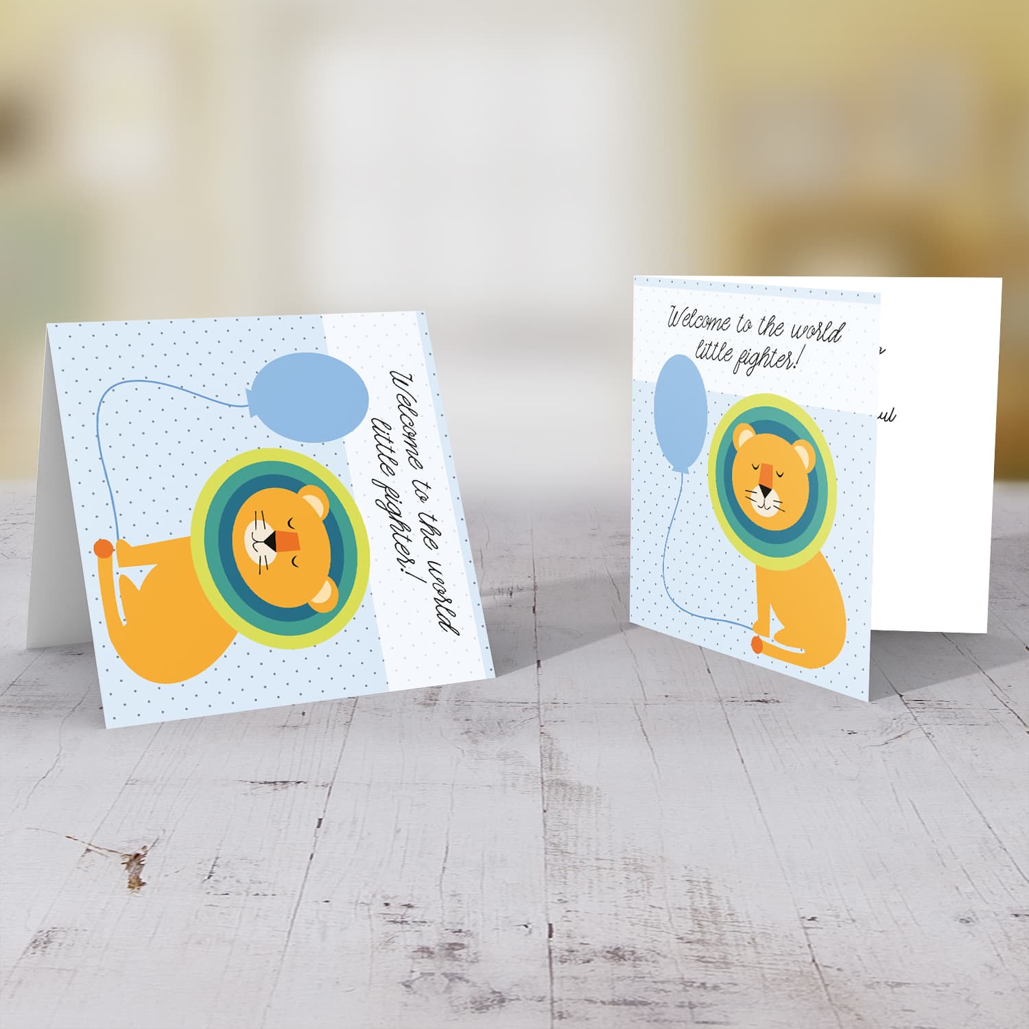 Lion holding blue balloon new born card in English