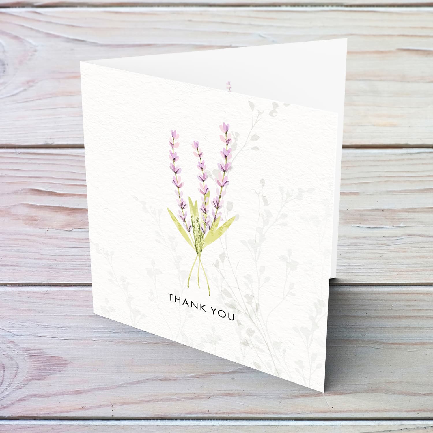 A dainty minimalist thank card featuring a light purple / pink floral detail in English