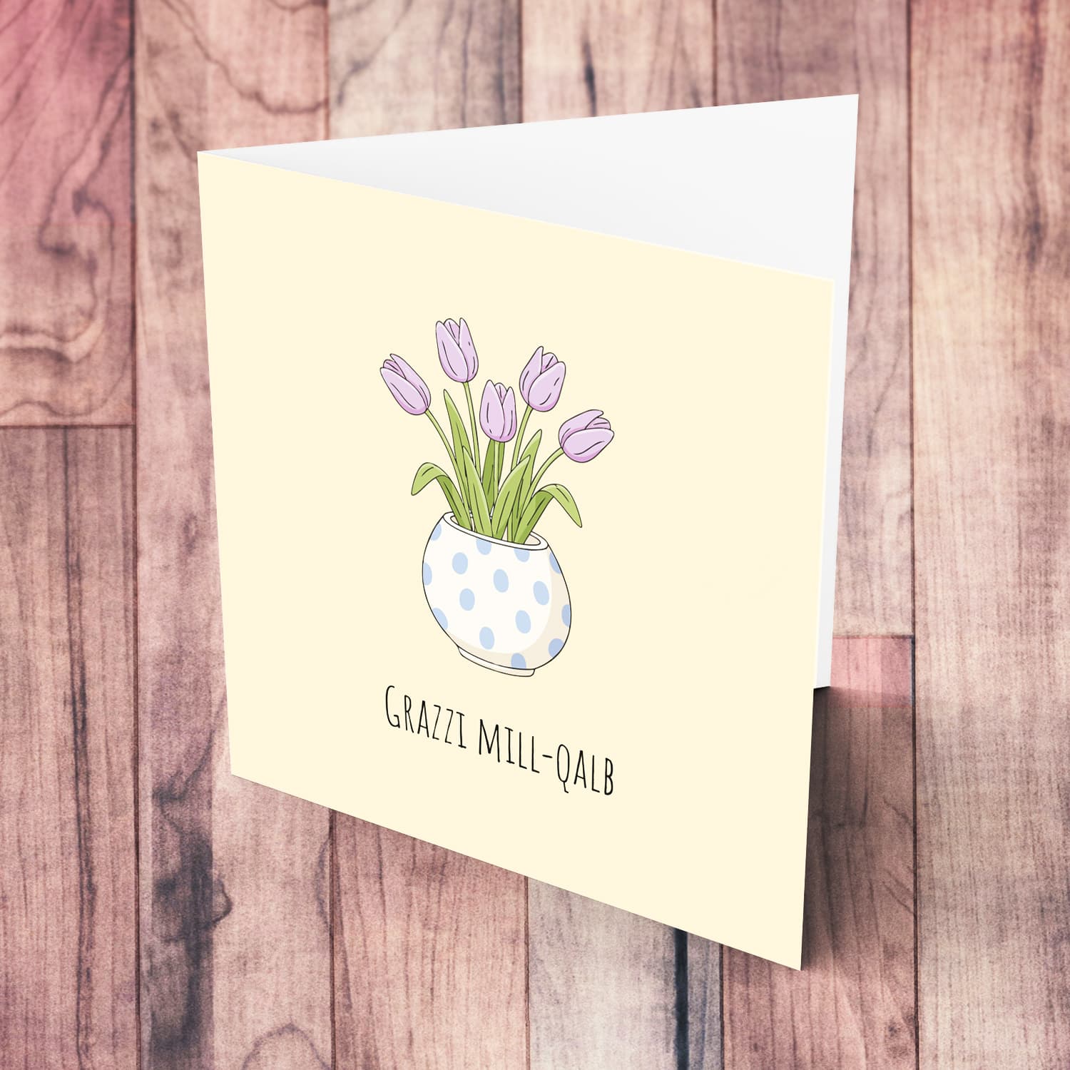 A beautiful thank you card featuring light purple tulips in spotted vase and neutral background in Maltese