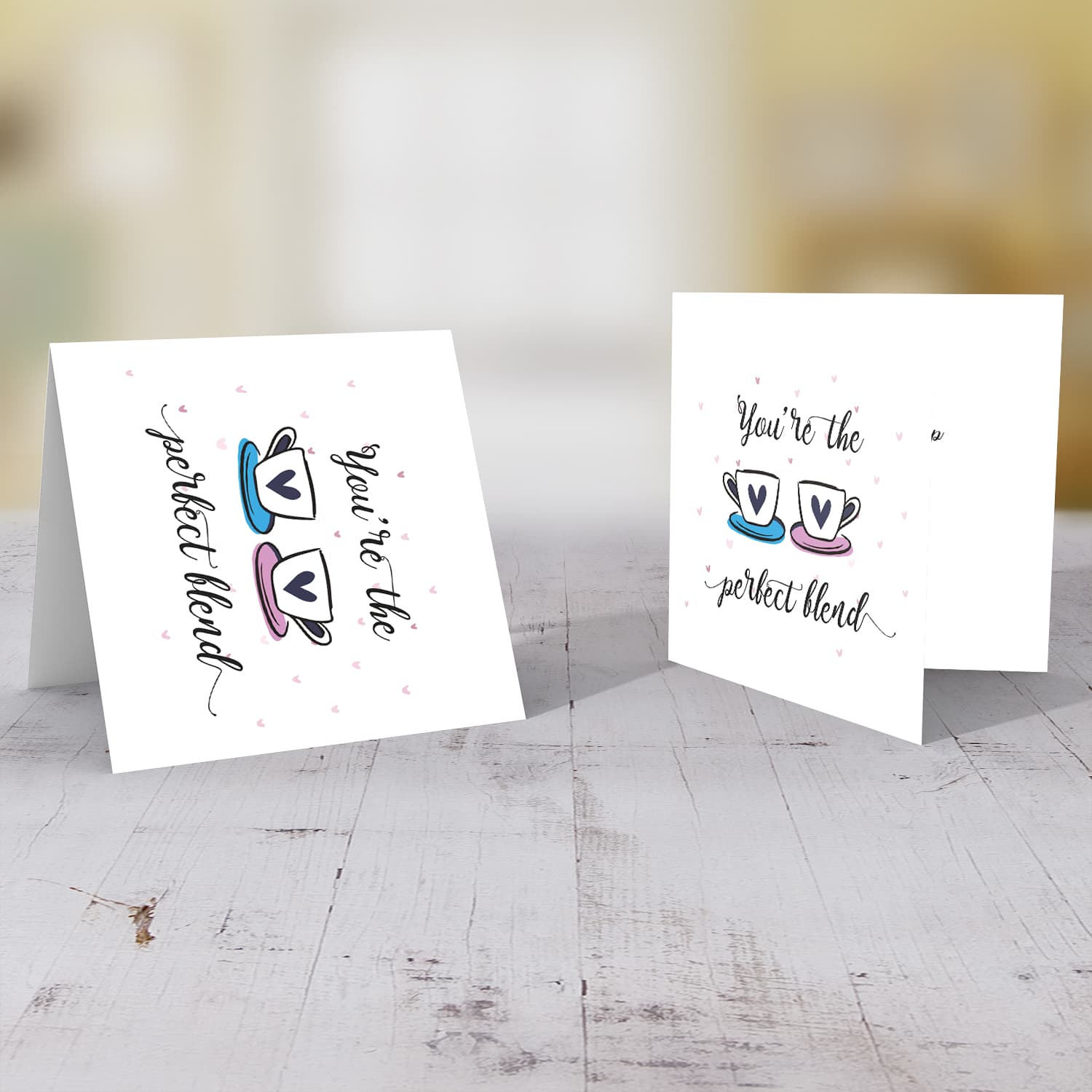 Cup themed wedding / engagement card with scattered hearts in English 