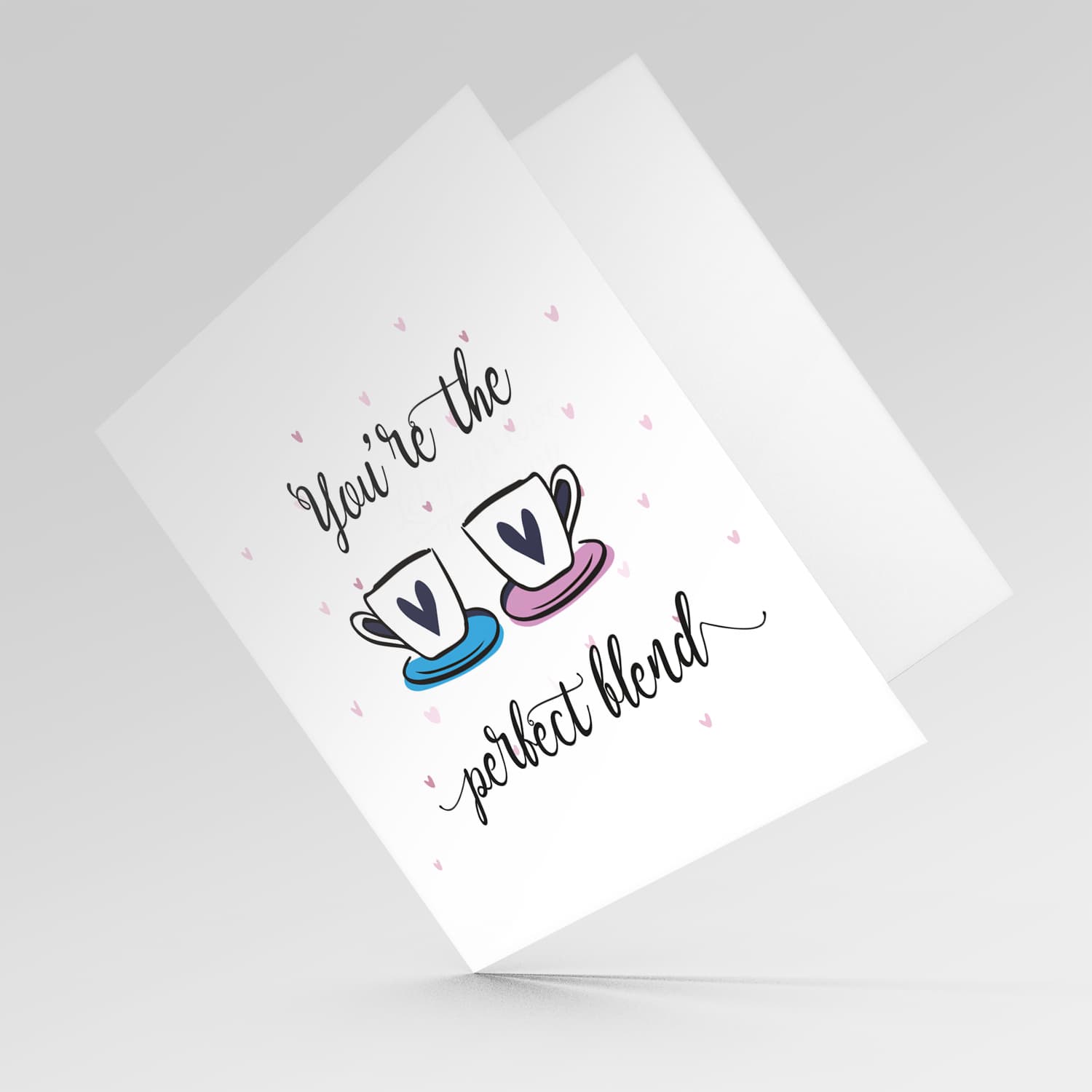 Cup themed wedding / engagement card with scattered hearts in English 