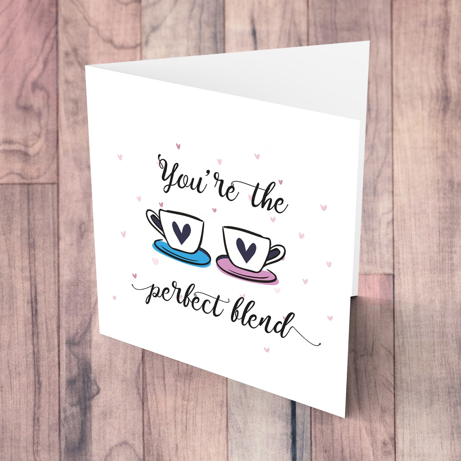 Cup themed wedding / engagement card with scattered hearts in English 