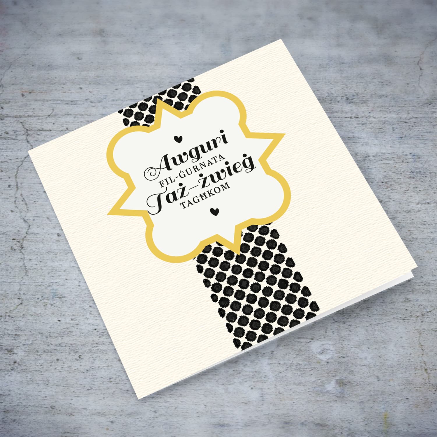 Textured printed background with dotted rectangle wedding card in Maltese
