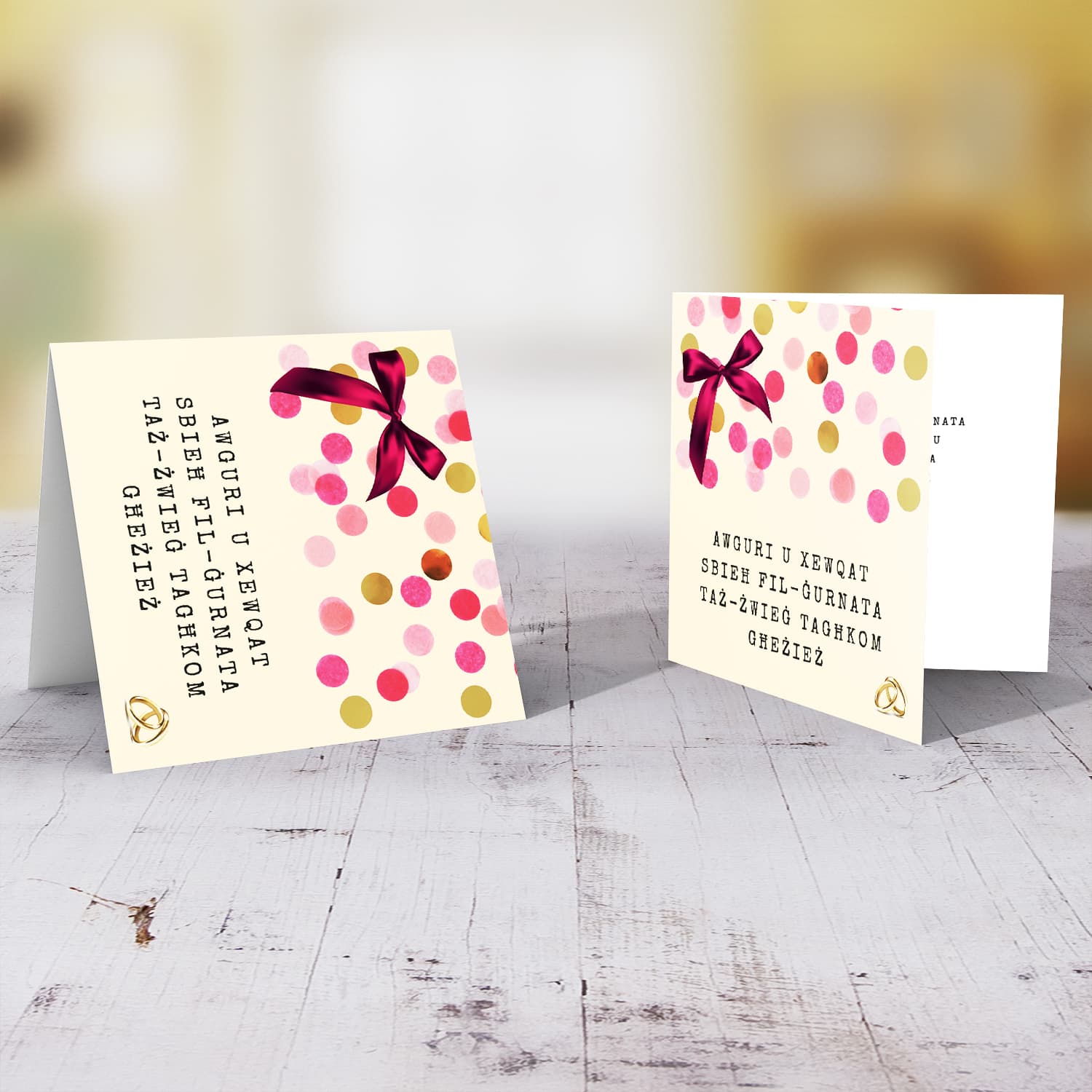 Cute wedding card with pink bow and scattered colourful confetti in Maltese