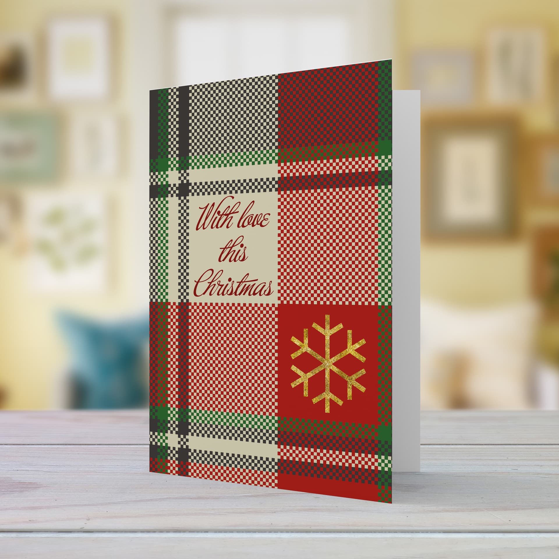 A beautiful A5 Christmas card in a tartan print, featuring a golden snowflake in English 