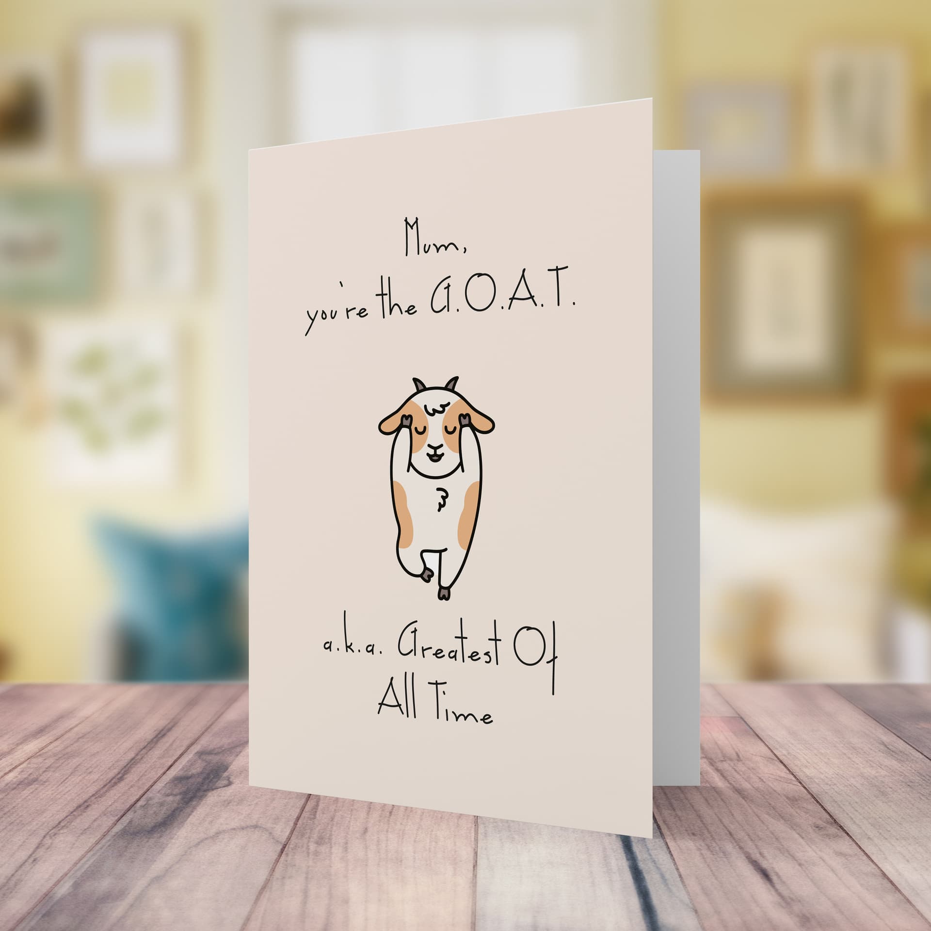 A funny mother's day - birthday card, in a light pink background, featuring a GOAT - Greatest of all time, in English 