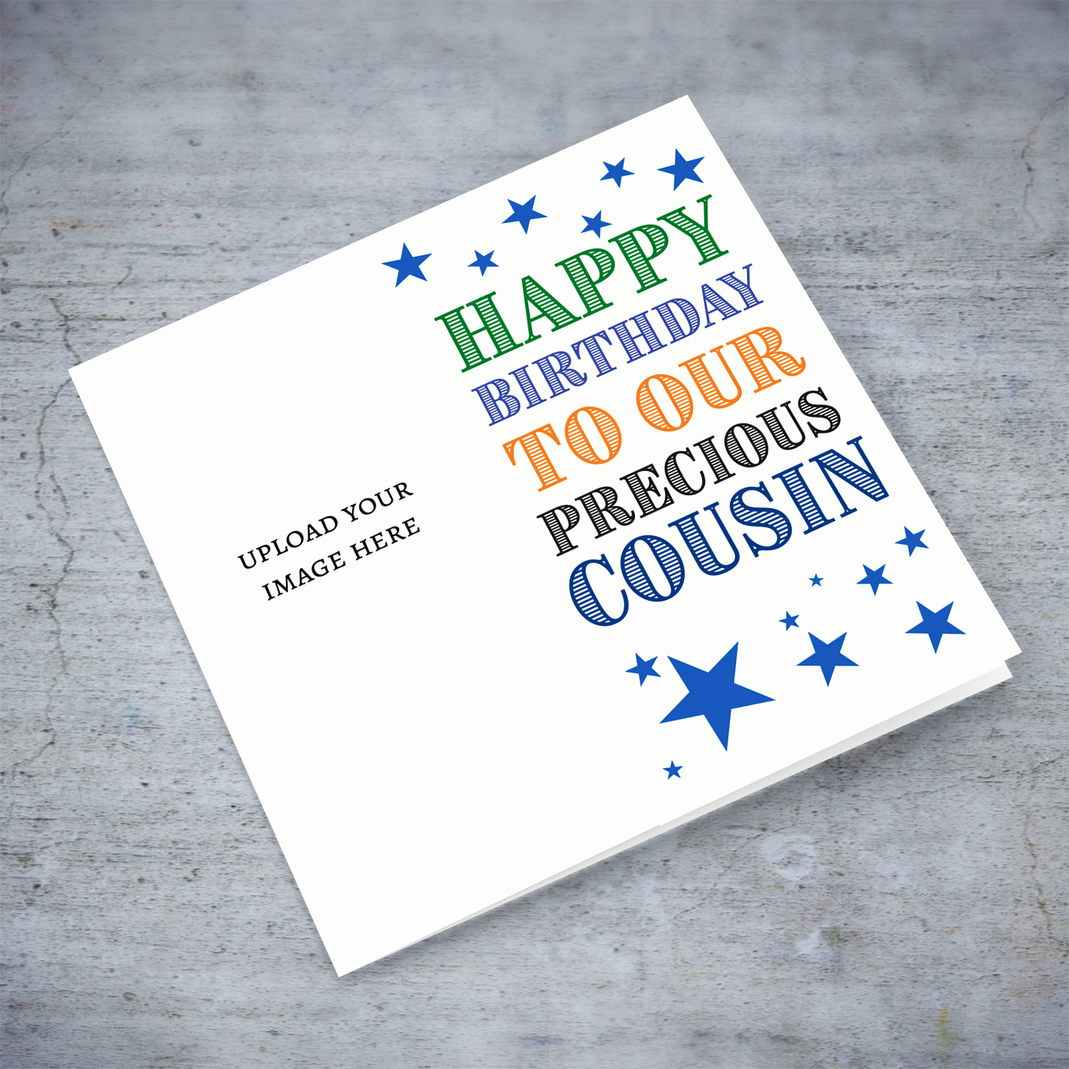 A portrait photo birthday card in colourful text for cousin with scattered blue stars in English 