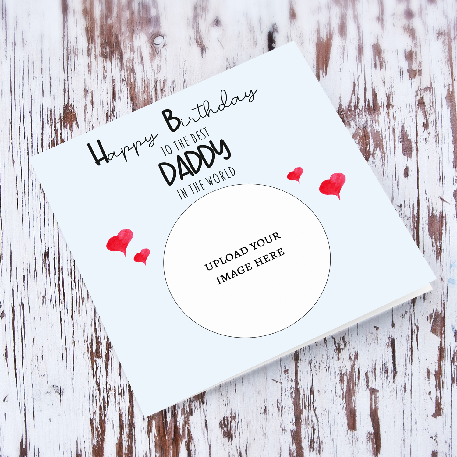 A light blue coloured photo birthday card to the best daddy in the world with small red hearts in English
