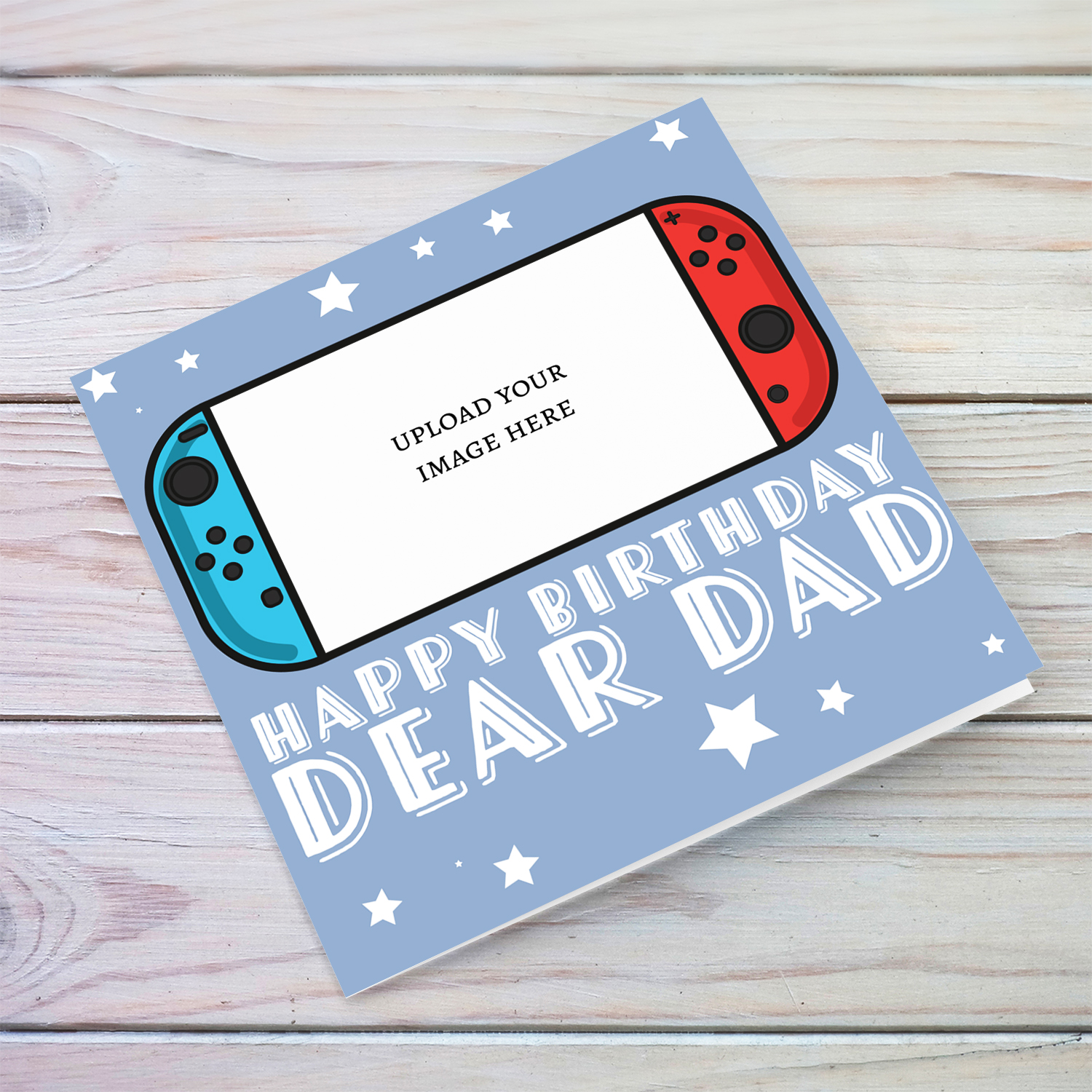 A photo birthday card for dad featuring a nintendo cartoon design, in a light blue background with scattered white stars in English