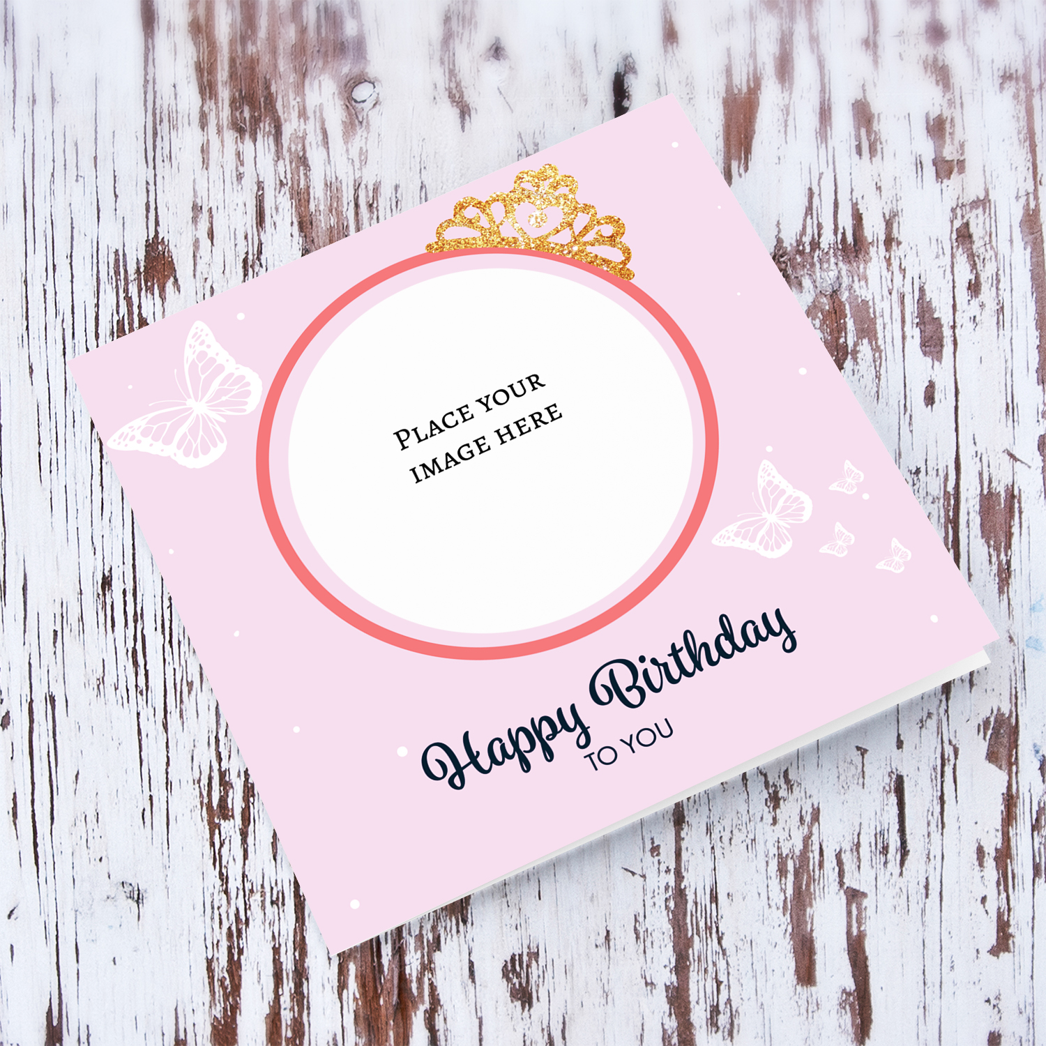 Pink coloured background birthday card with butterflies and crown photo card in English