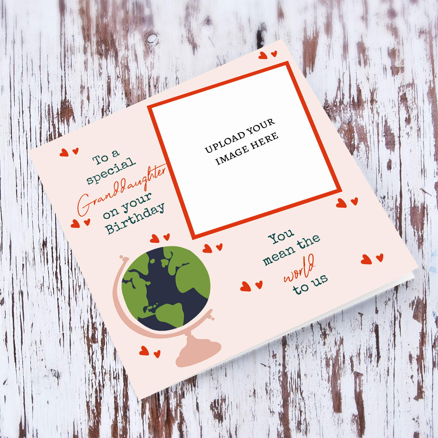 A beautiful photo card for Granddaughter - You mean the world to us - in light pink background, scattered hearts and a globe in English