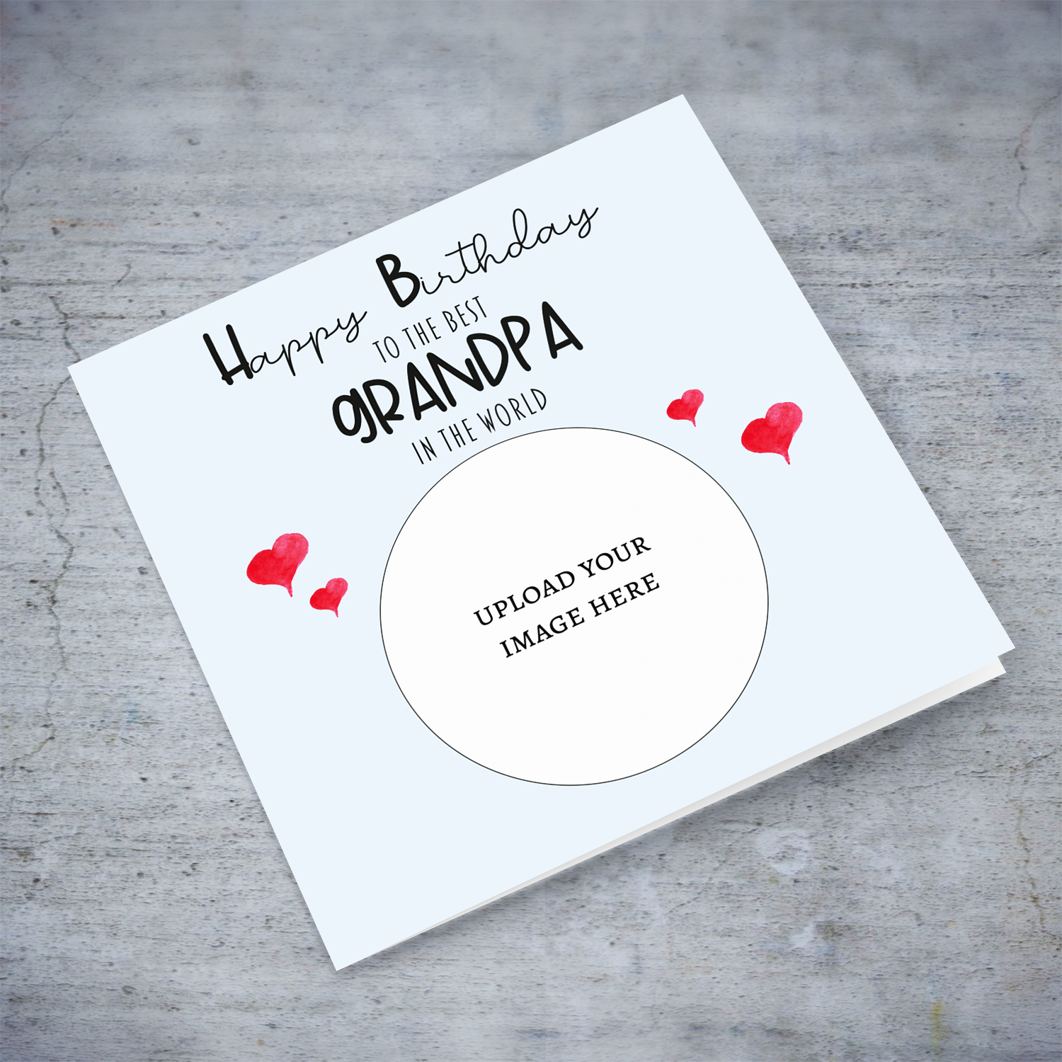 A light blue coloured photo birthday card to the best grandpa in the world with small red hearts in English