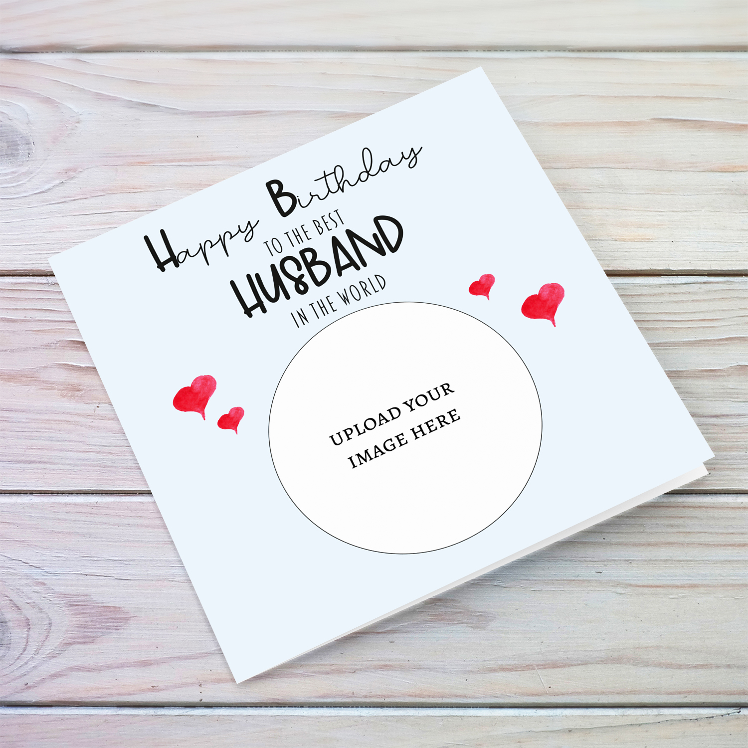 A light blue coloured photo birthday card to the best husband in the world with small red hearts in English