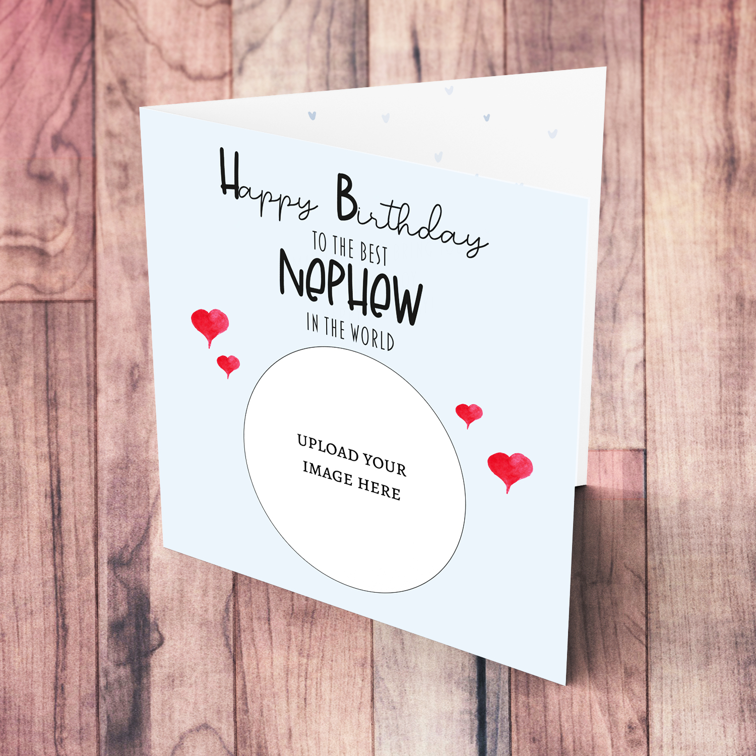 A light blue coloured photo birthday card to the best nephew in the world with small red hearts in English