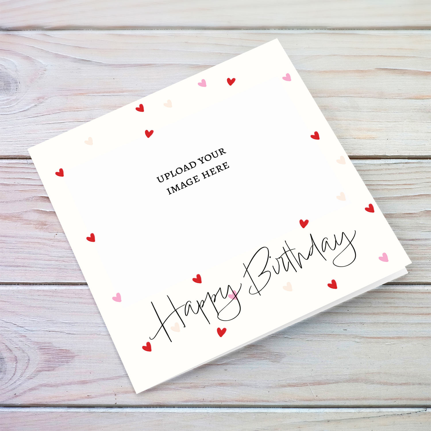 A cute photo birthday card in a neutral cream colour background with scattered red and pink hearts in English (Blank message)