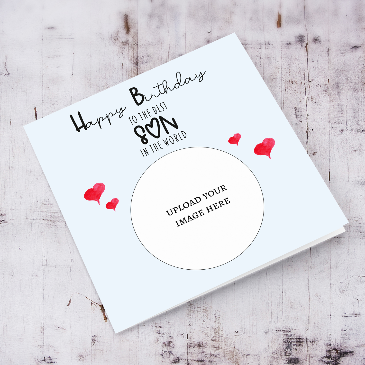 A light blue coloured photo birthday card to the best son in the world with small red hearts in English