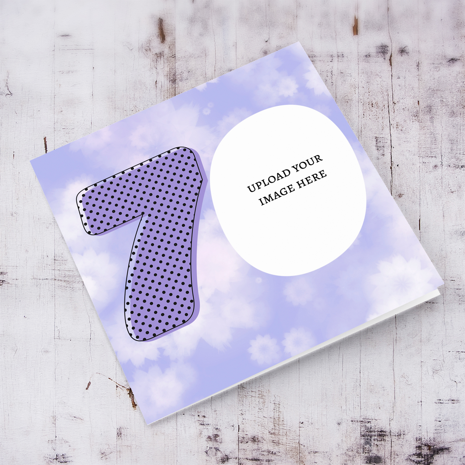 Open photo card in a colourful purple flowery background for 70th birthday with a blank message inside
