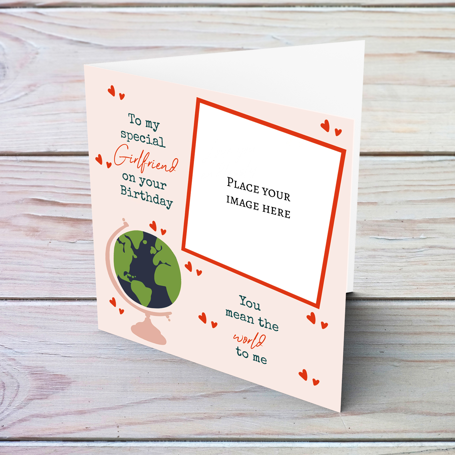 A romantic photo card for Girlfriend - You mean the world to me - in light pink background, scattered hearts and a globe in English