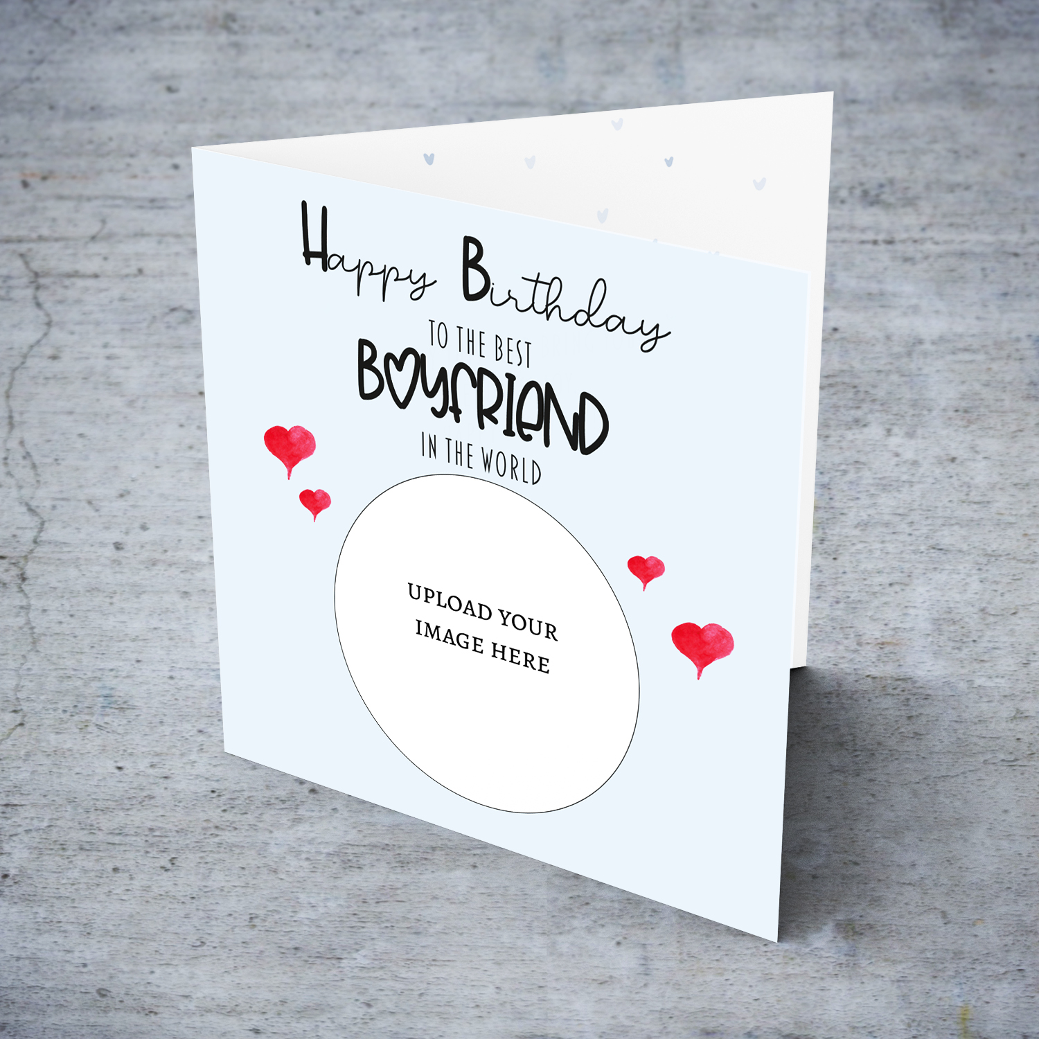 A light blue coloured photo birthday card to the best boyfriend in the world with small red hearts in English