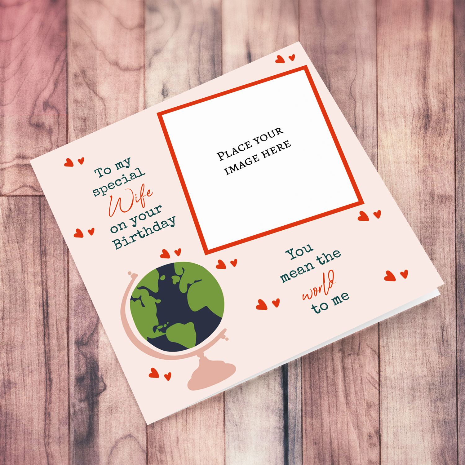 A romantic photo card for Wife - You mean the world to me - in light pink background, scattered hearts and a globe in English