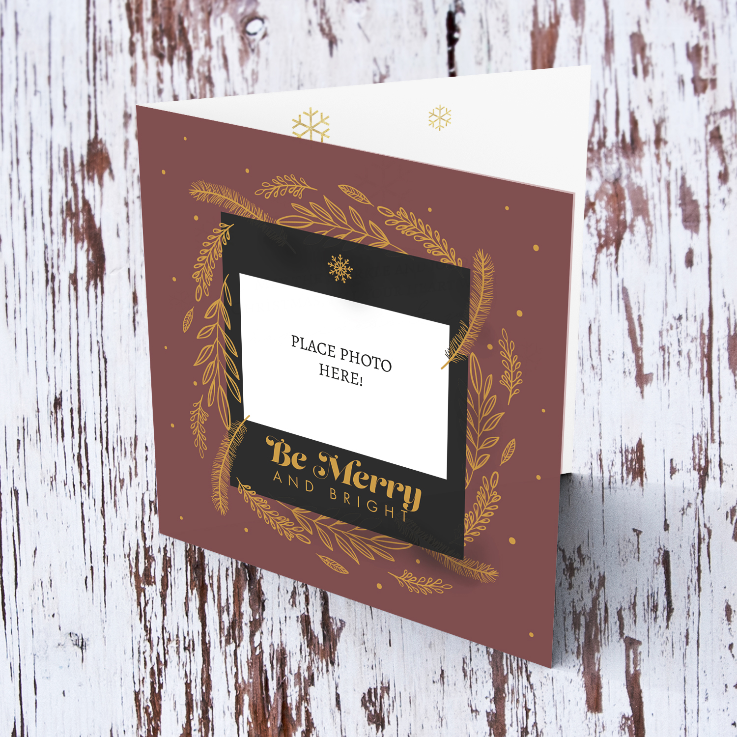 Christmas card in dark background and gold leaves - be merry and bright in English