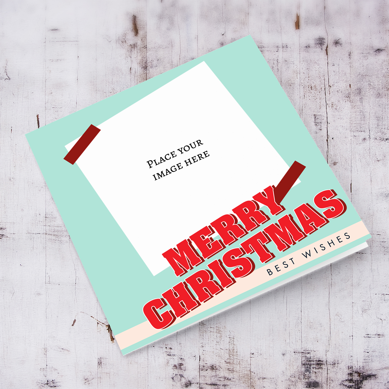 Open Christmas photo card with light turquoise background, red bold text in English
