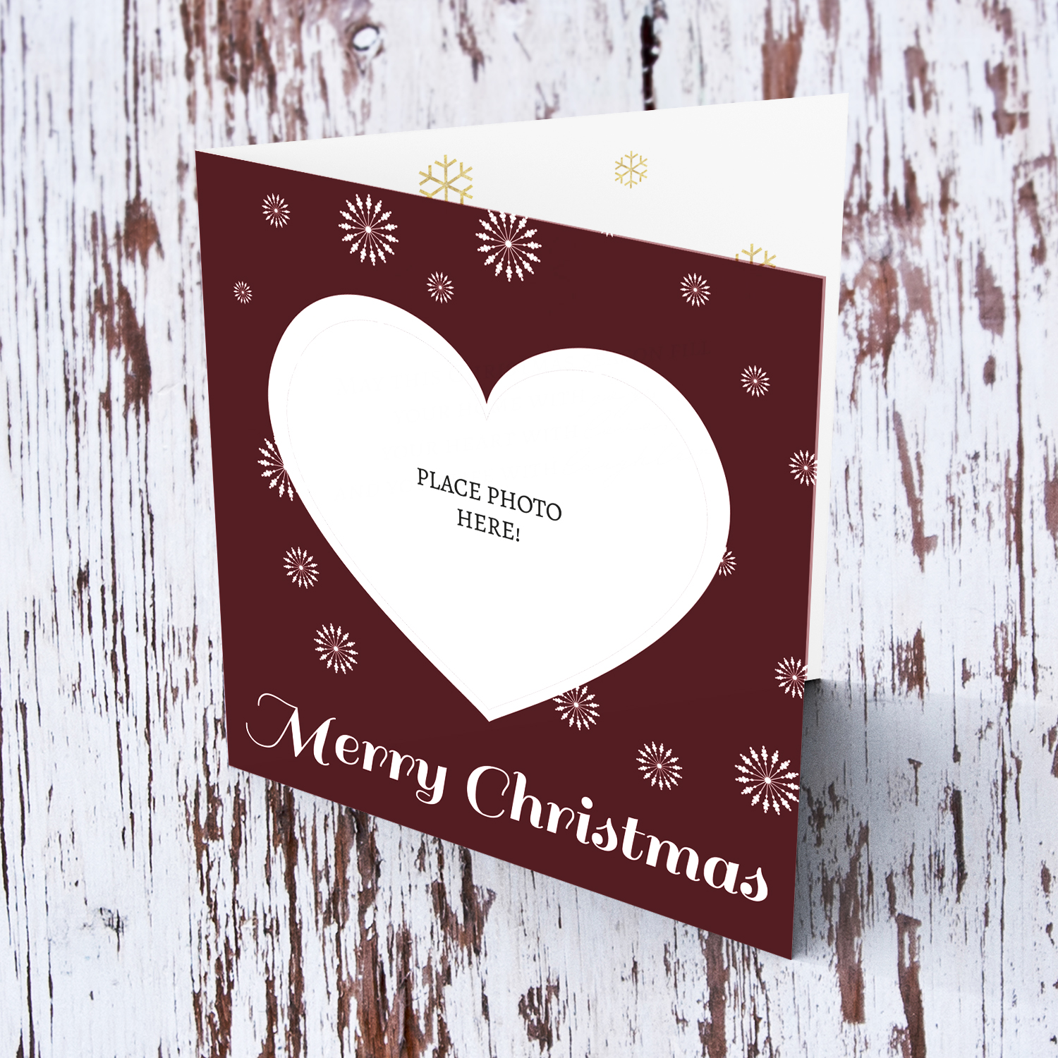 Heart shaped open Merry Christmas card in dark red background in English