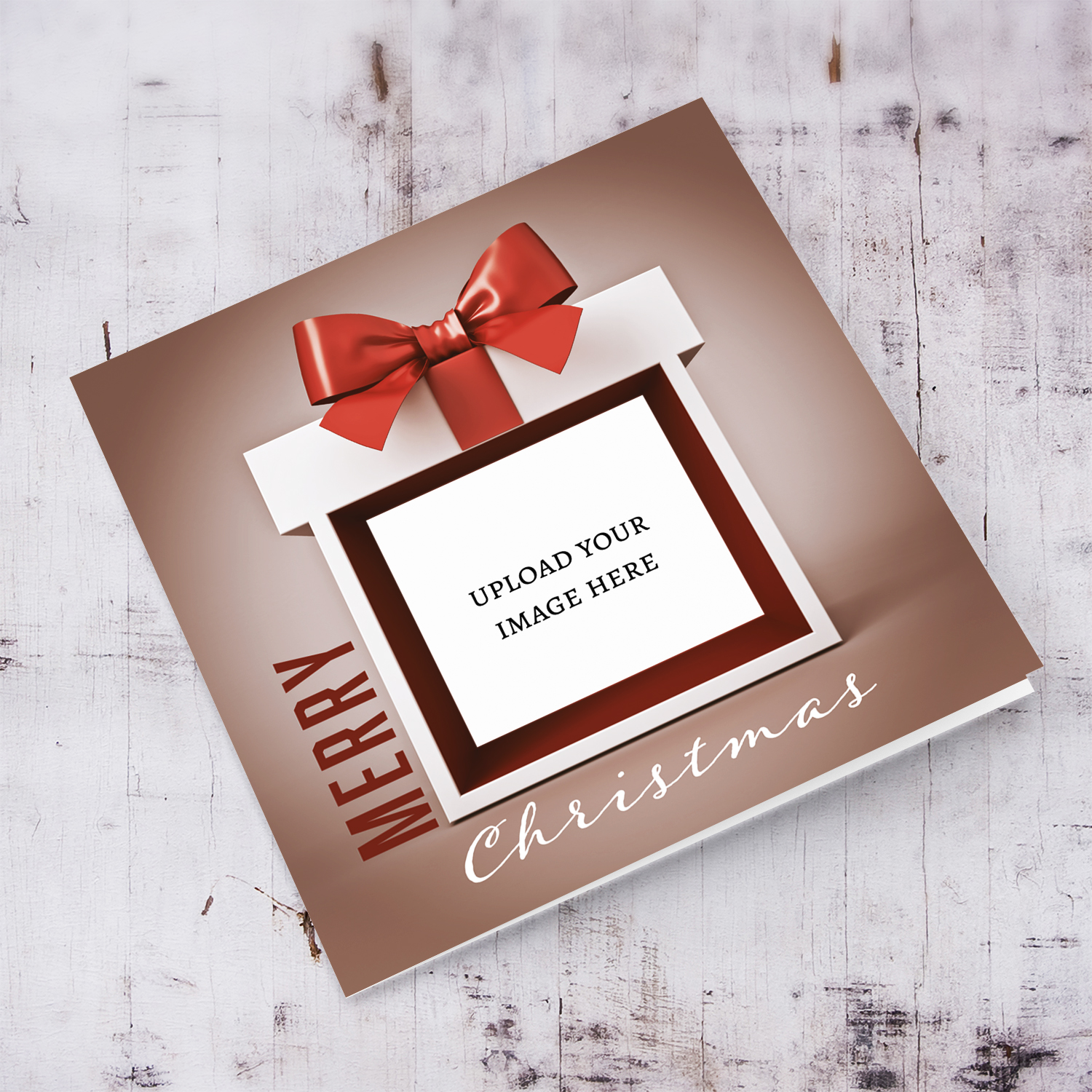 A festive open Christmas photo card featuring a gift-inspired design, beautifully wrapped present border and a big, elegant bow in English