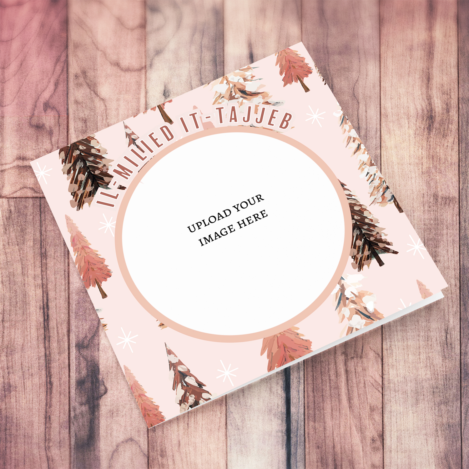 An open Christmas card in various pink tones, featuring a background with different Christmas trees in Maltese