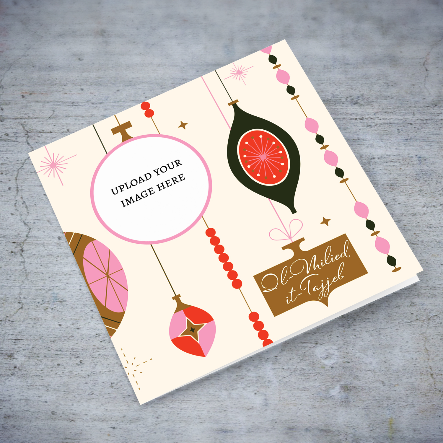 A beautiful photo Christmas card in colourful hanging decorations and baubles, with touches of pink and gold in Maltese 
