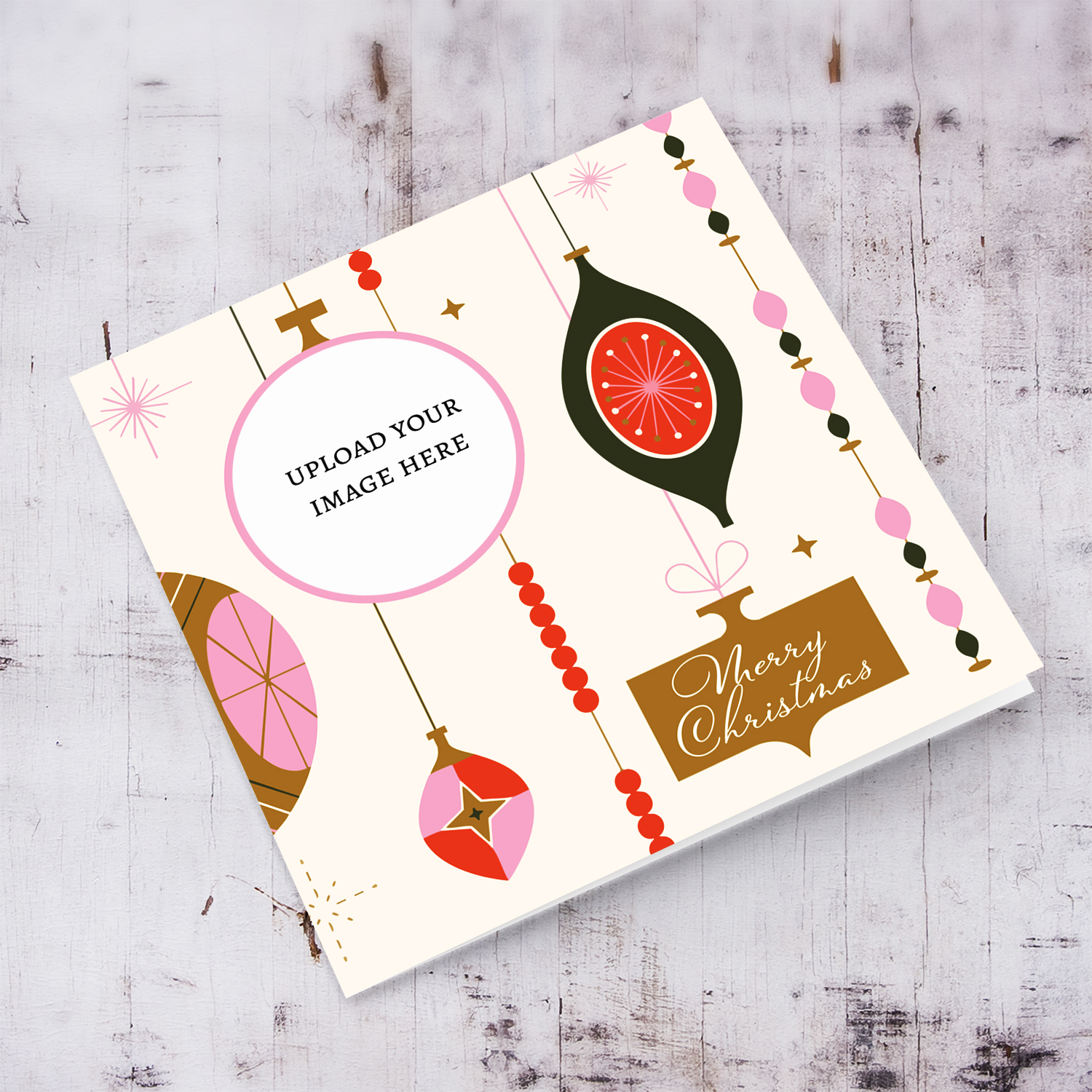 A beautiful photo Christmas card in colourful hanging decorations and baubles, with touches of pink and gold in English