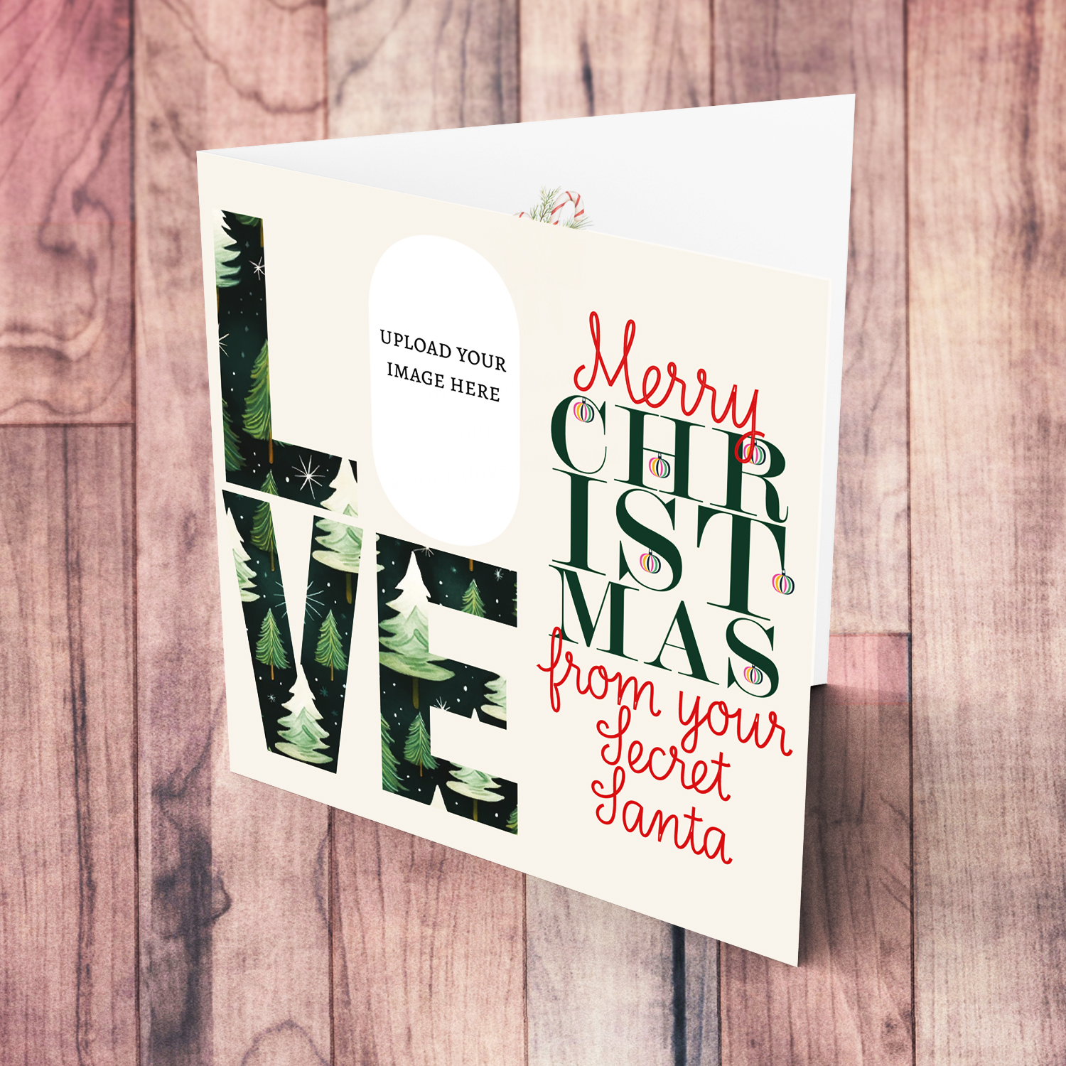 A modern photo Christmas card for Secret Santa in red and green text, featuring LOVE with a Christmassy background in English