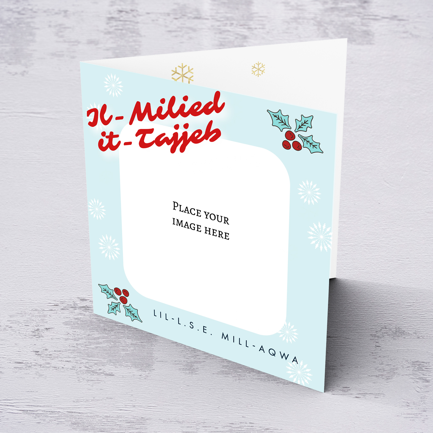 L.S.E. photo Christmas card with light blue background, Christmas hollies, and scattered white snowflakes in Maltese