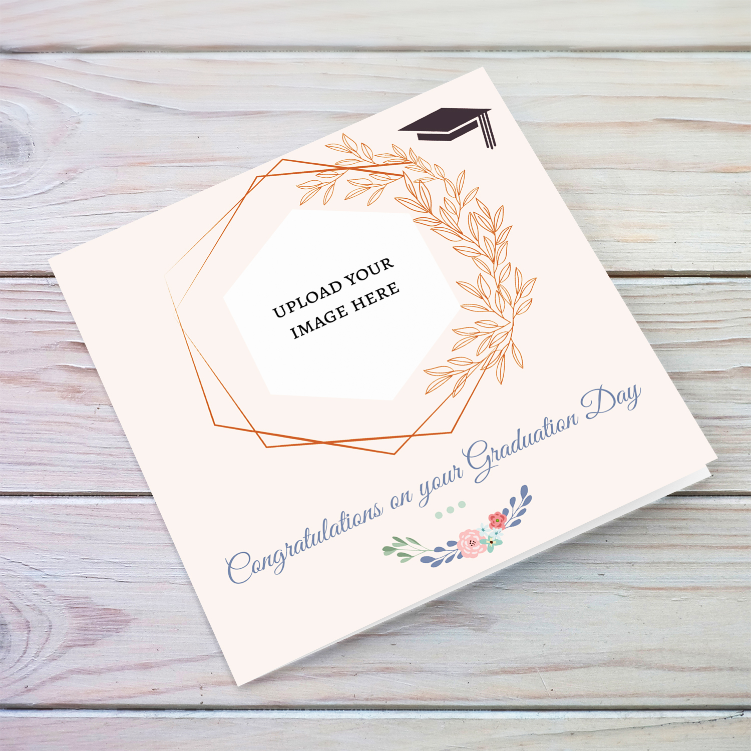 Light pink background photo graduation card, with graduation hat and flowers in English