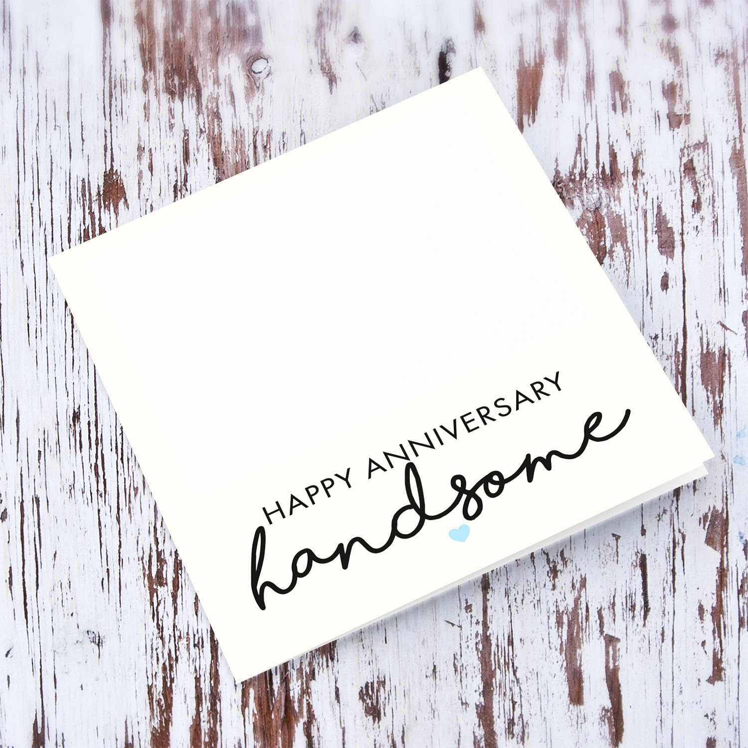 Minimalist photo anniversary card with cream background and light blue heart in English